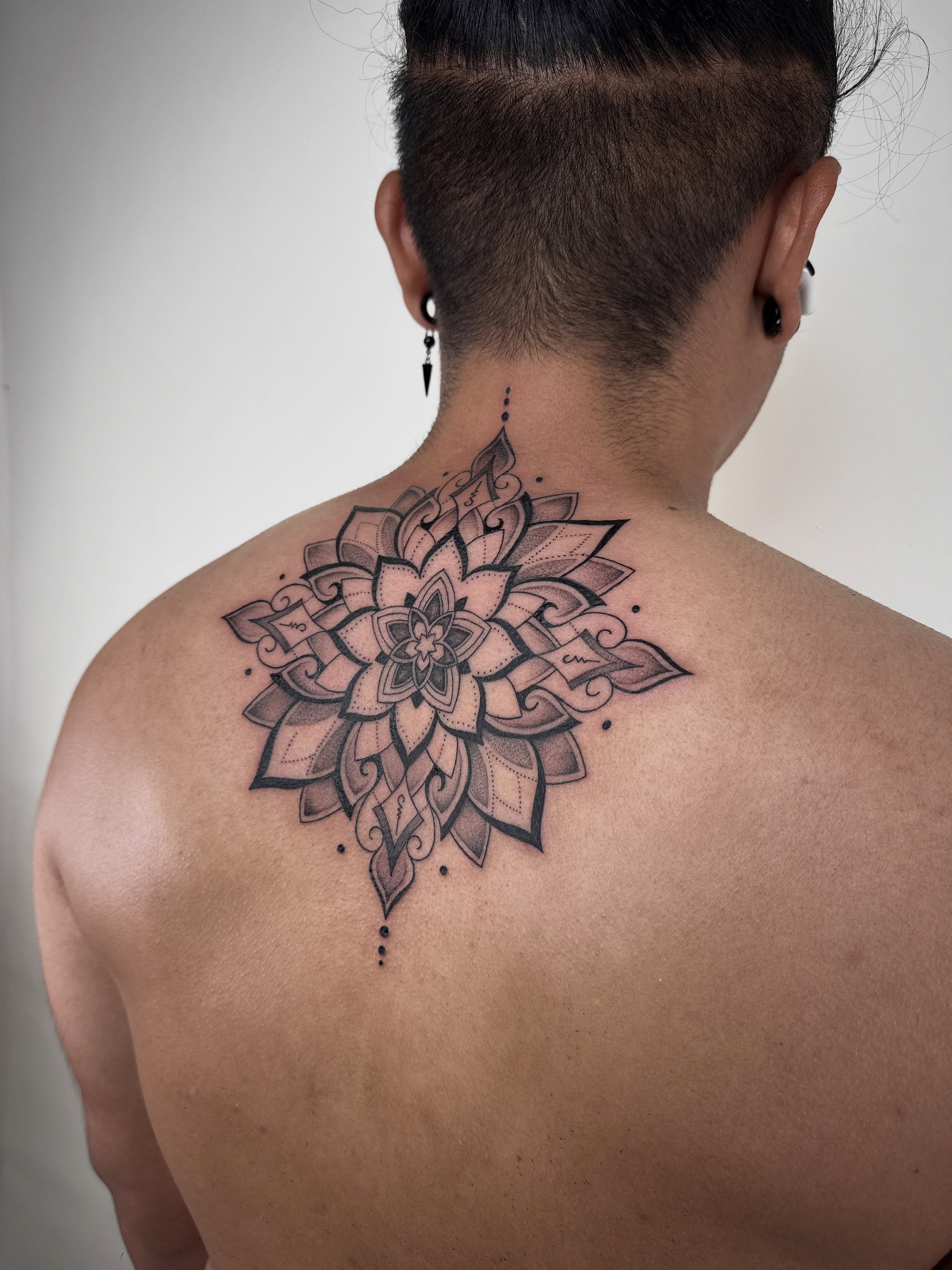 Mandala dotwork tattoo on the back by Jadyn Pang