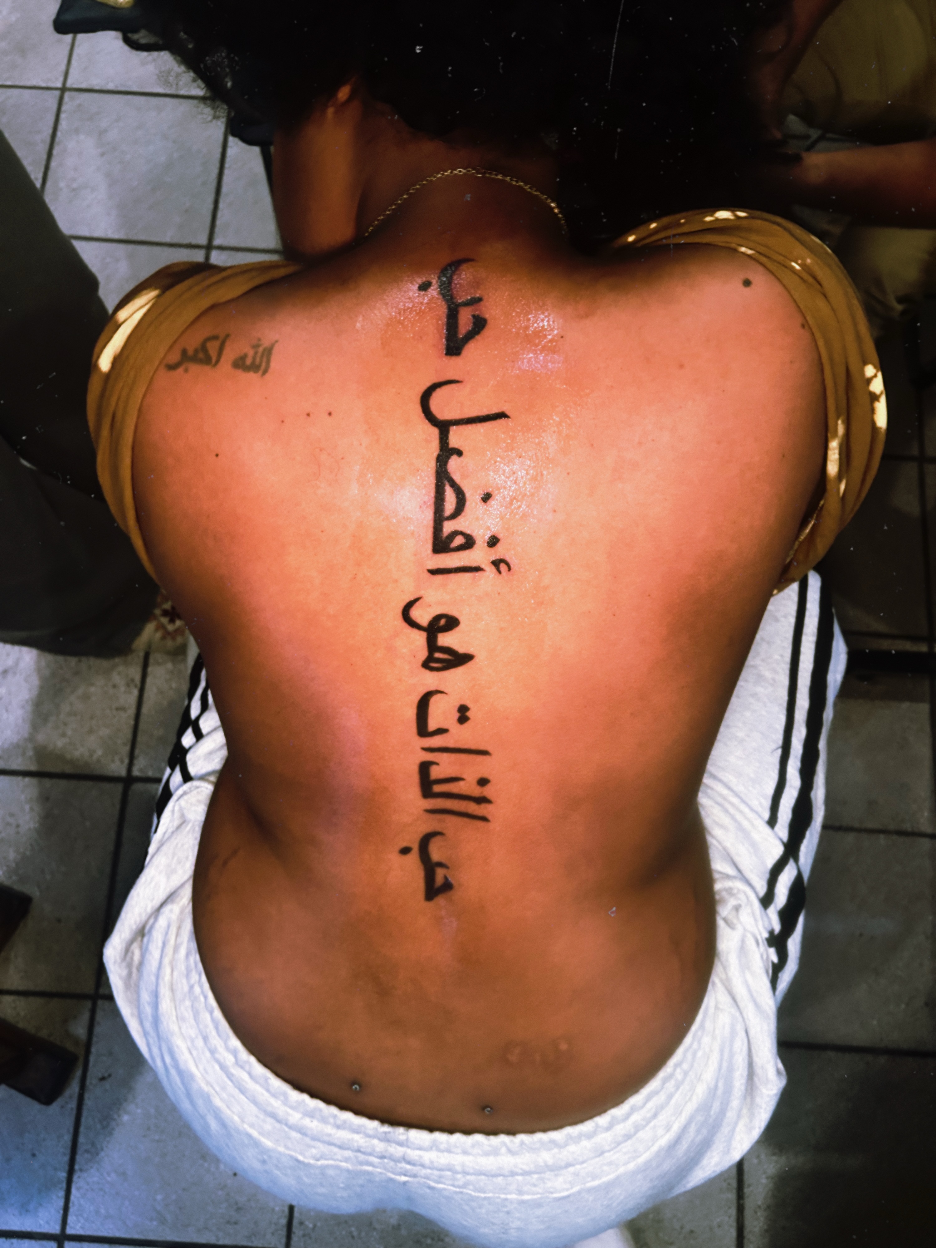 Script lettering lettering script tattoo on the back by Tito Cross ❤️‍🔥