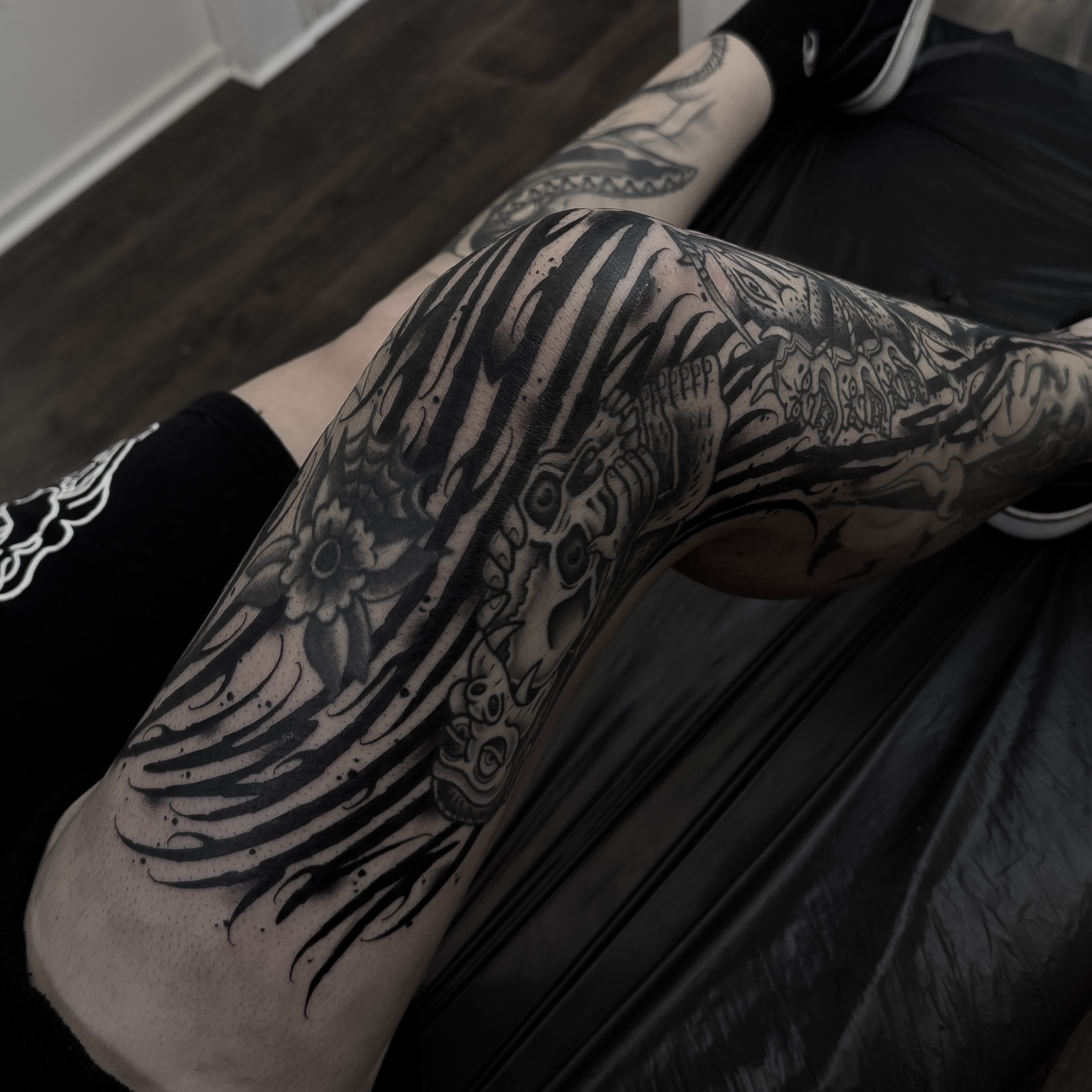 Skull and flames tribal tattoo on the thigh by ⚔️Andreas Dolleschal⚔️