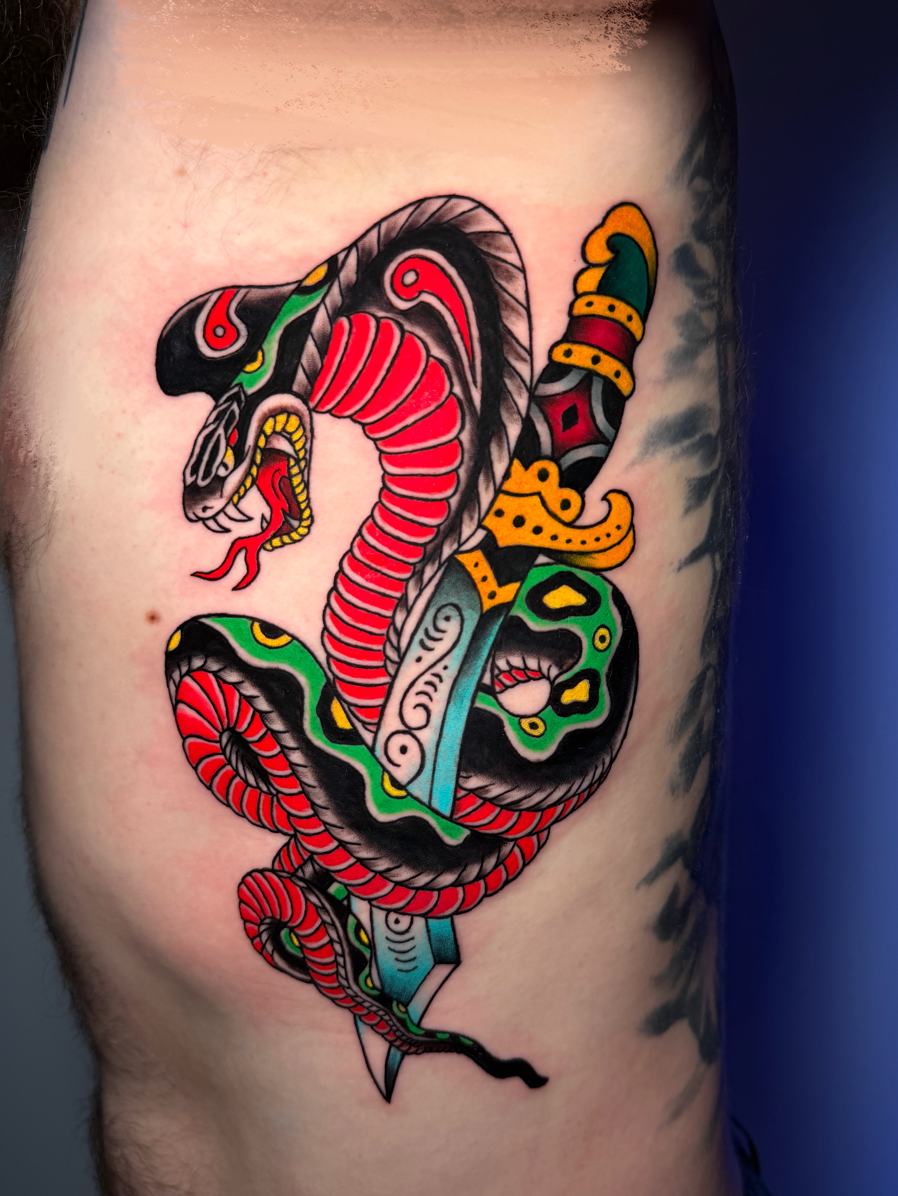 Snake and dagger American traditional tattoo on the thigh by Tattoo Artist Los Angeles