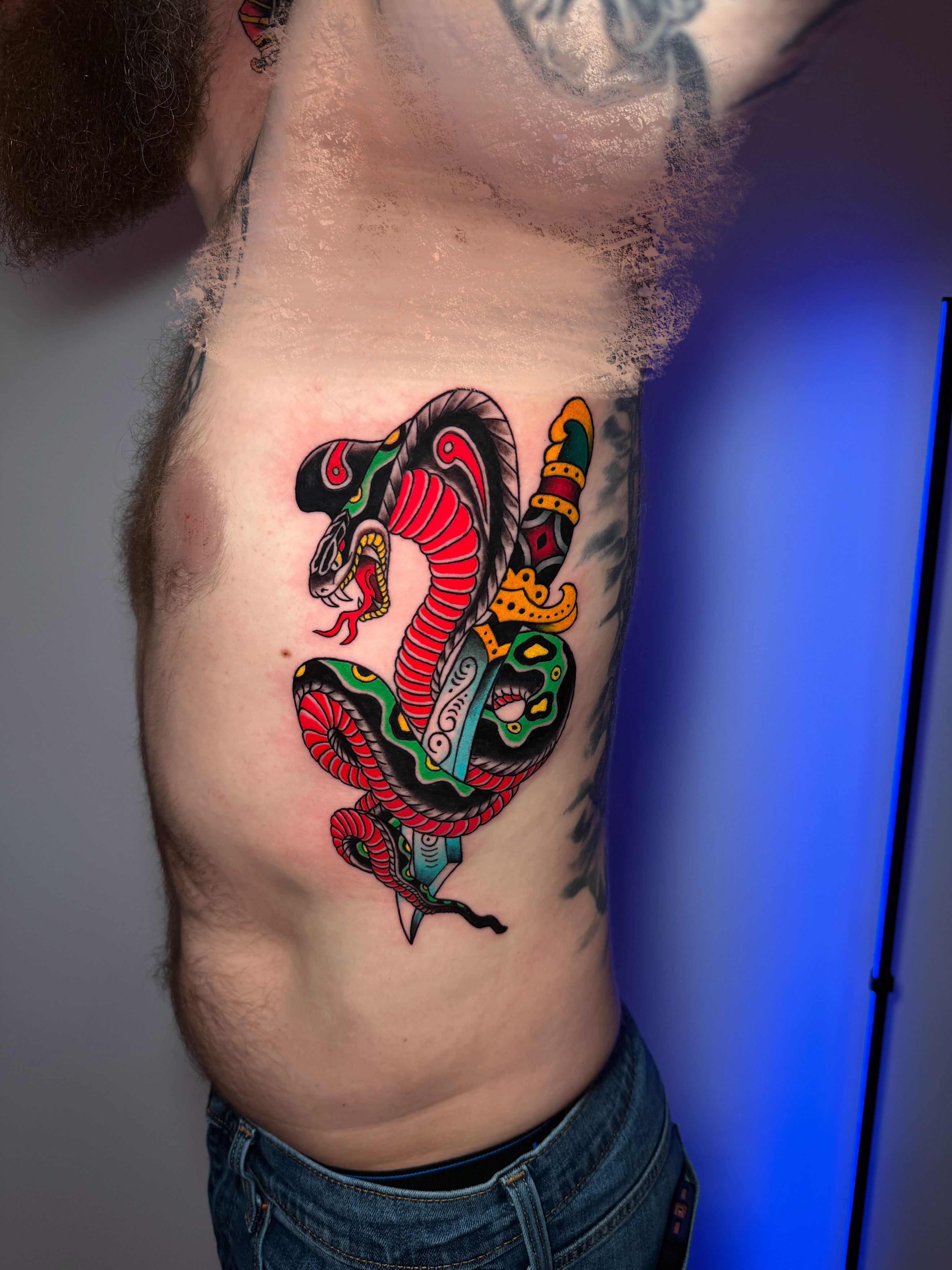 Snake American traditional tattoo on the ribs by Tattoo Artist Los Angeles