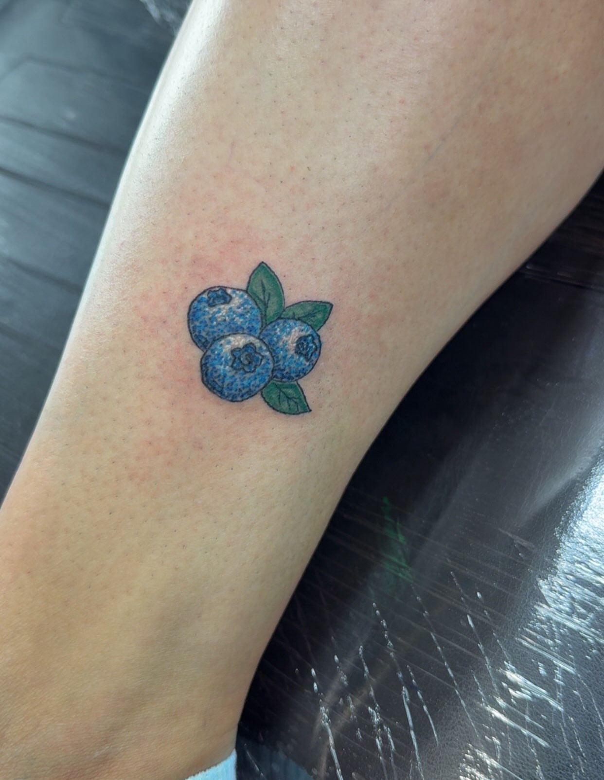 Blueberries realism tattoo on the forearm by Felicia Lee, Des Moines, Iowa
