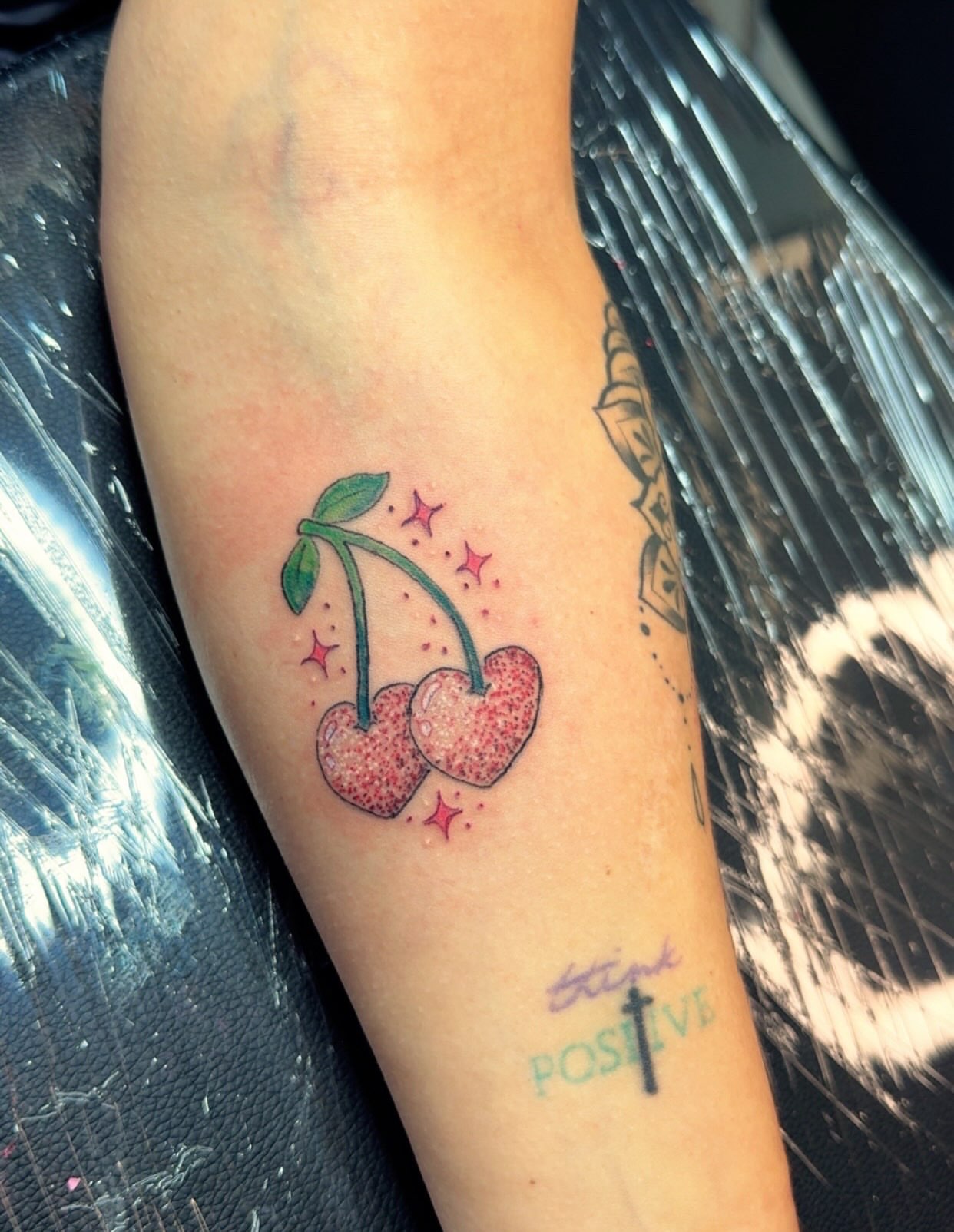 Cherry dotwork tattoo on the forearm by Felicia Lee, Des Moines, Iowa