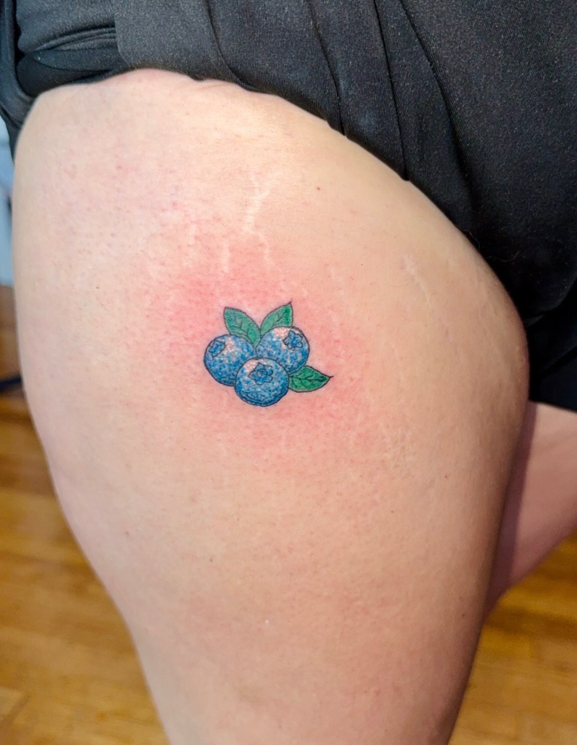 Blueberries dotwork tattoo on the thigh by Felicia Lee, Des Moines, Iowa
