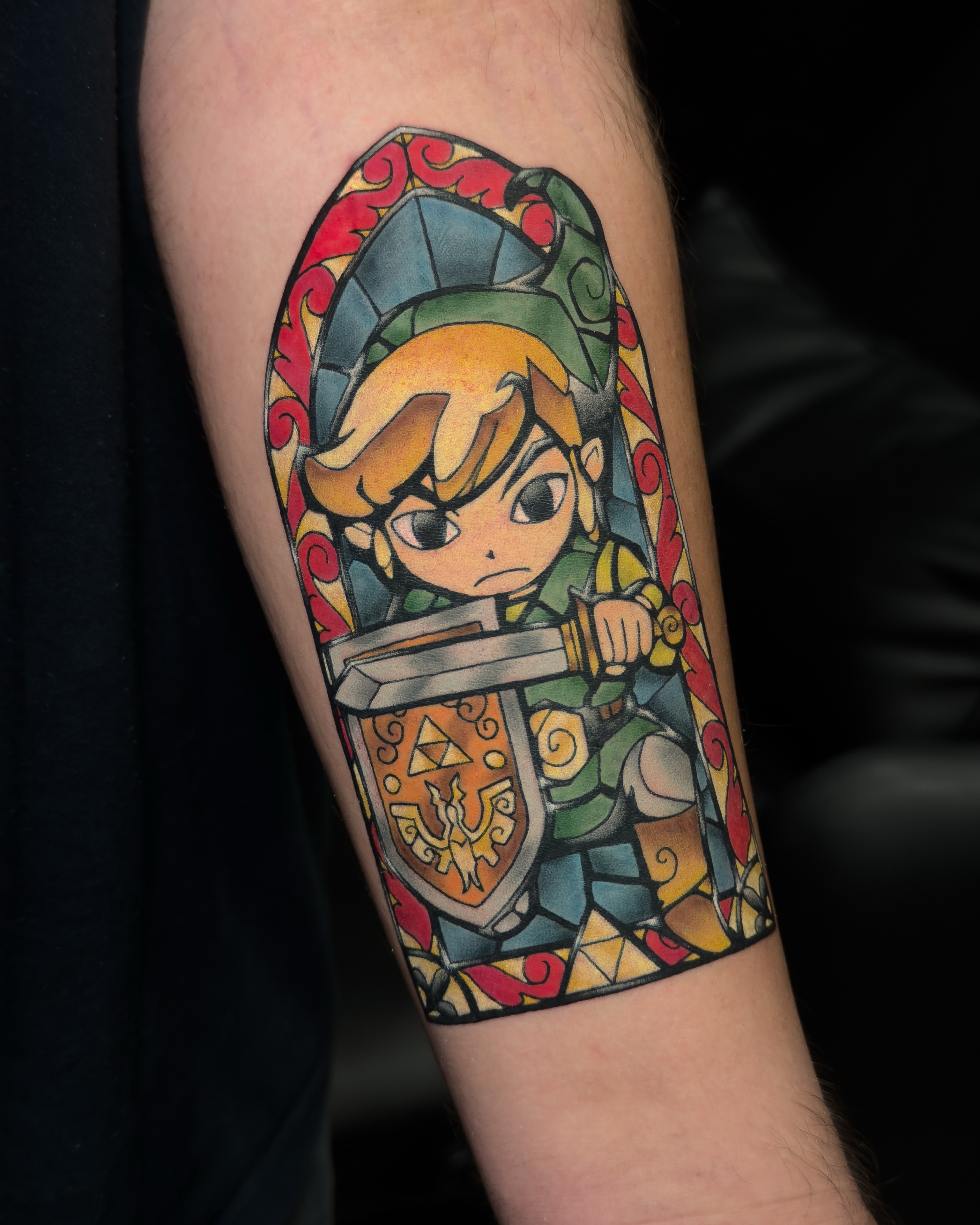 Link anime tattoo on the forearm by Tracci King