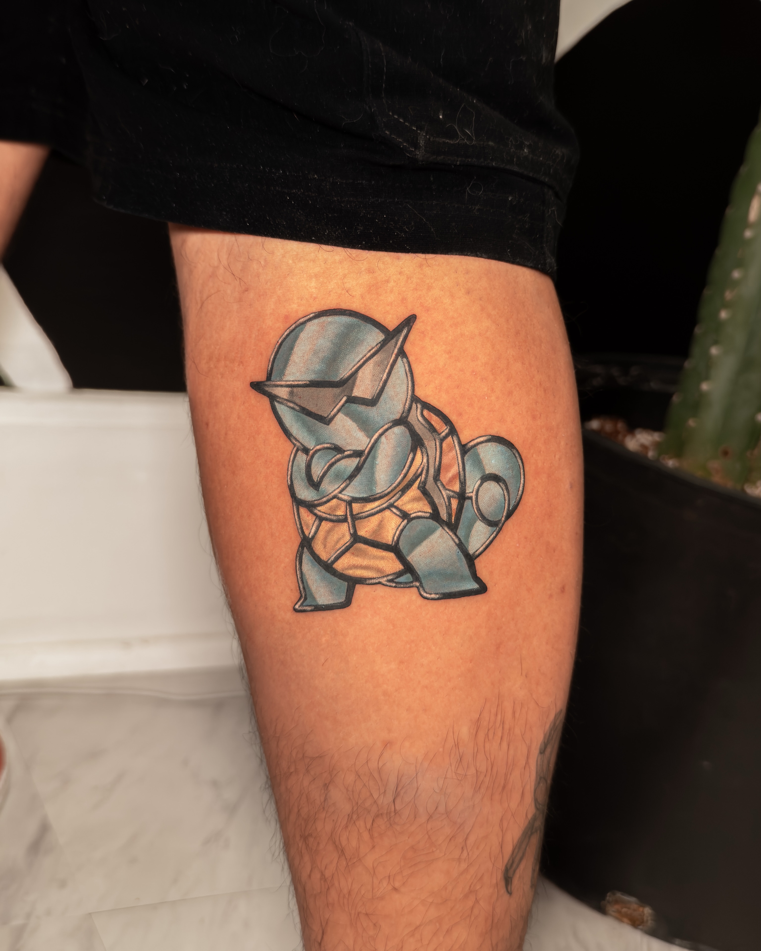 Robotic turtle geometric tattoo on the thigh by Tracci King