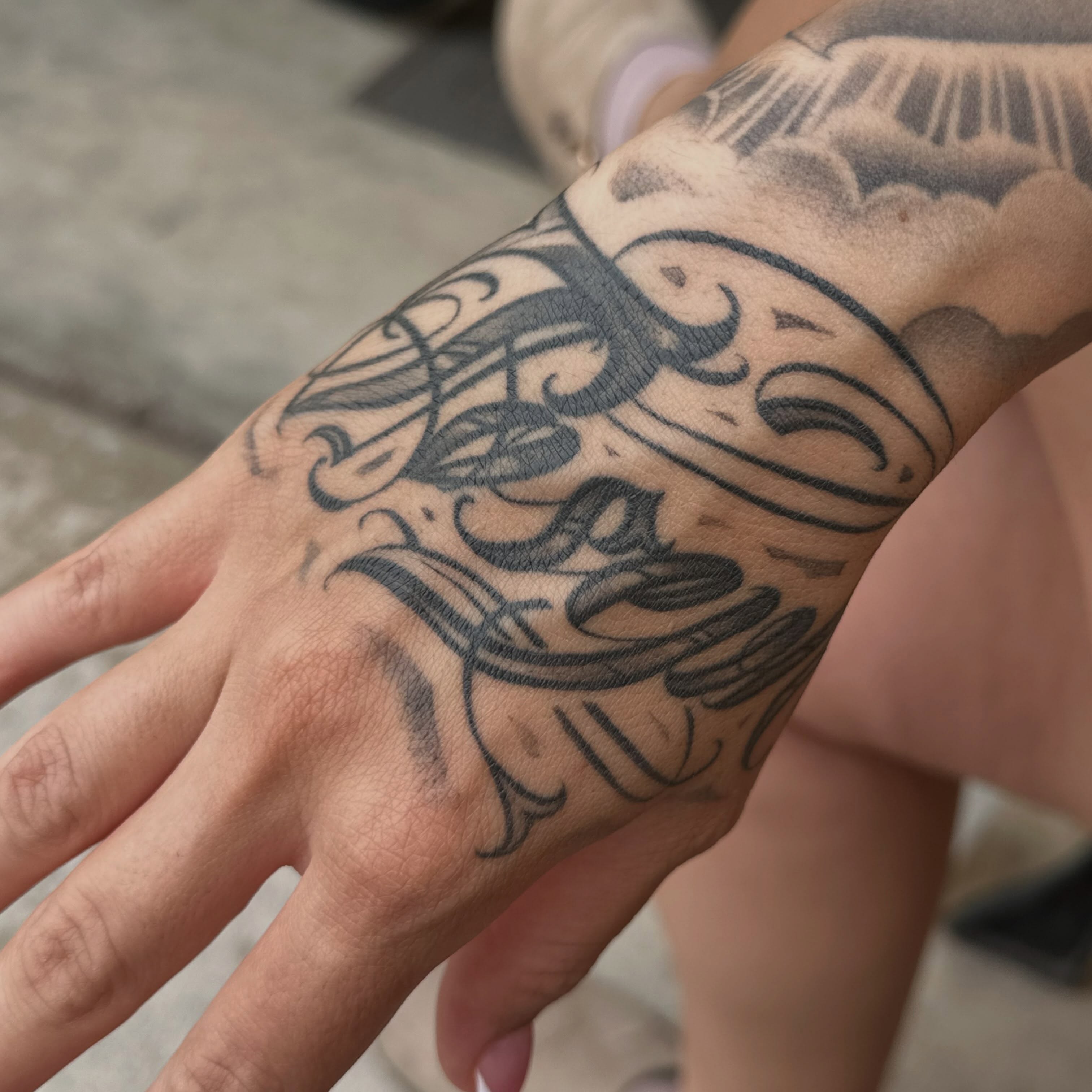 Scrollwork black and grey tattoo on the forearm by San Diego Tattoo Artist