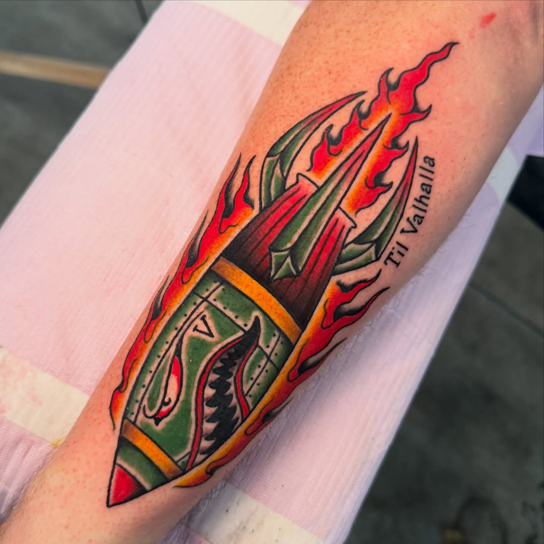 Flame and sword American traditional tattoo on the forearm by Zac Chaffin