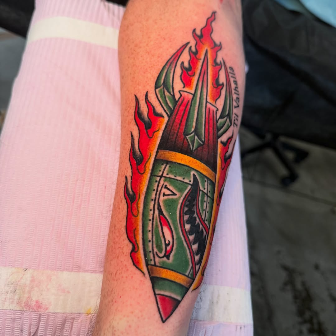 Flame and shield American traditional tattoo on the forearm by Zac Chaffin