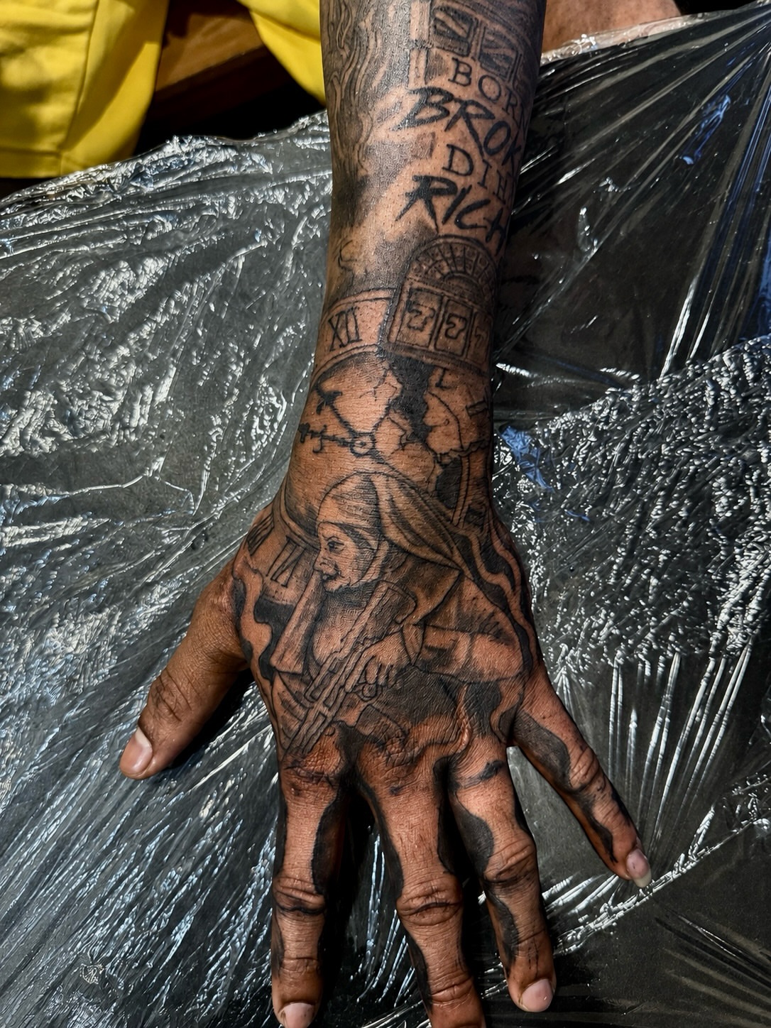 Religious figure black and grey tattoo on the hand by JayyeSosa