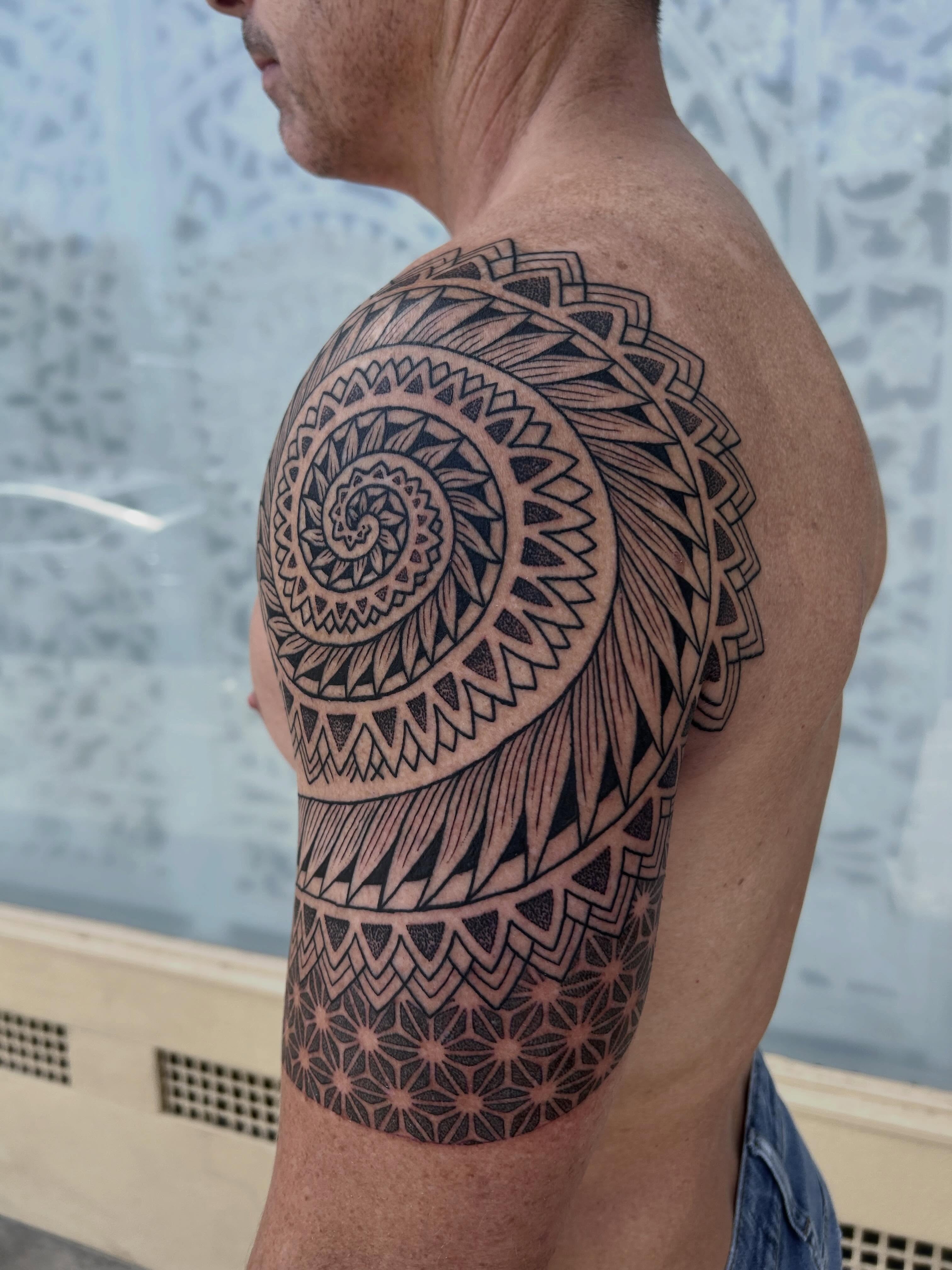 Geometric mandala geometric tattoo on the shoulder by Ravi Chandra, Mount Shasta, California