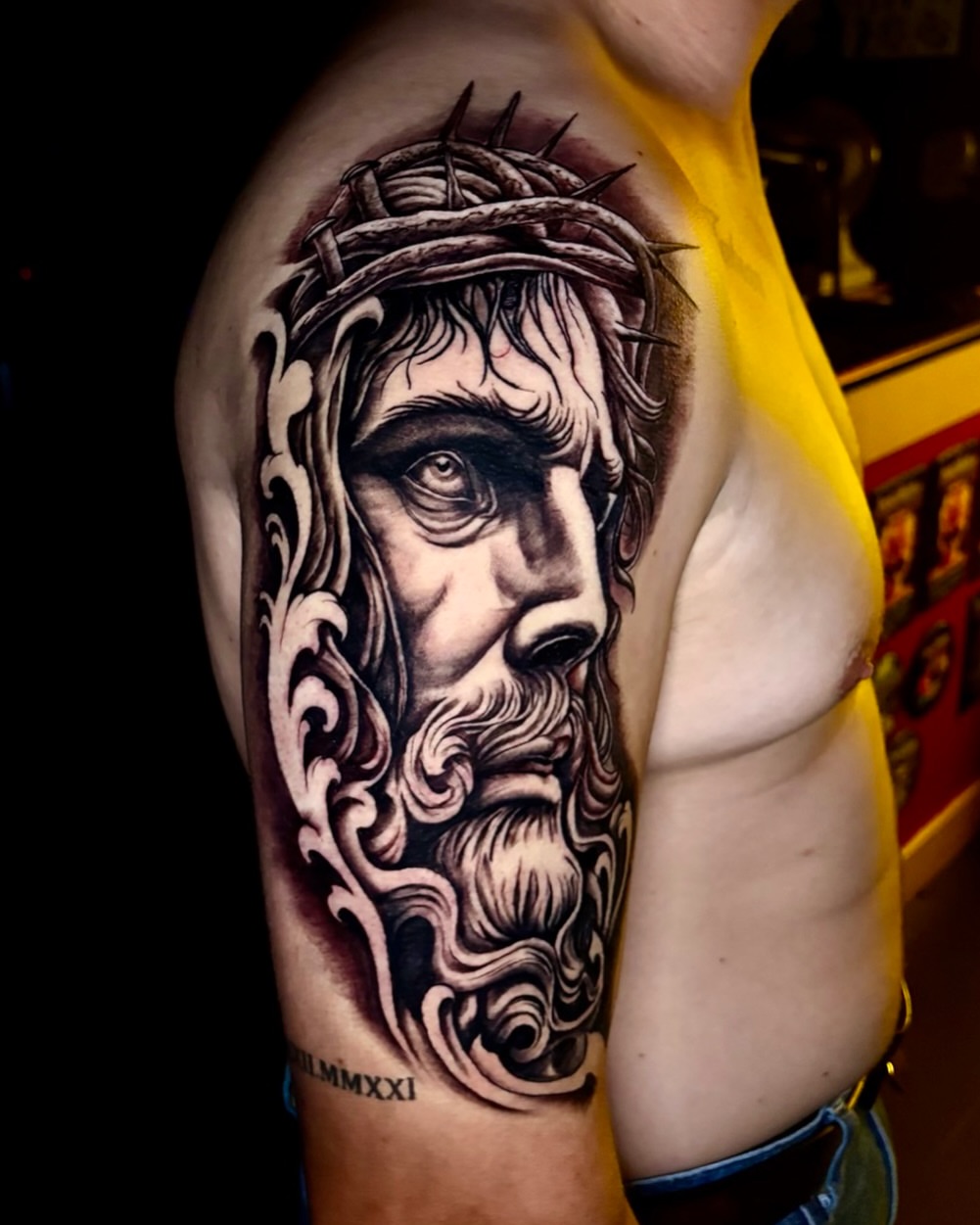 Religious figure realism tattoo on the shoulder by Deacon Moser