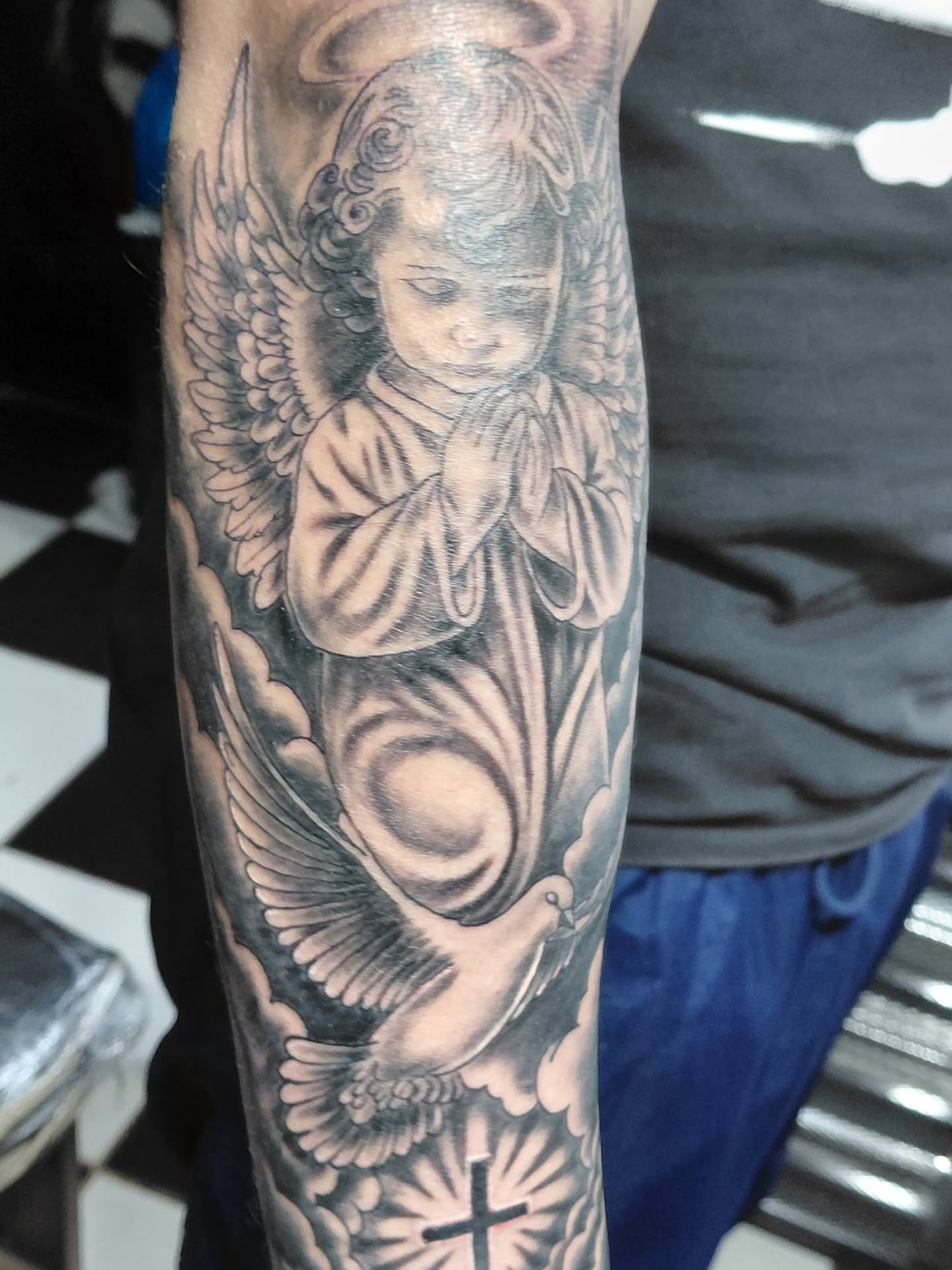 Angel realism tattoo on the forearm by Jose Rodriguez
