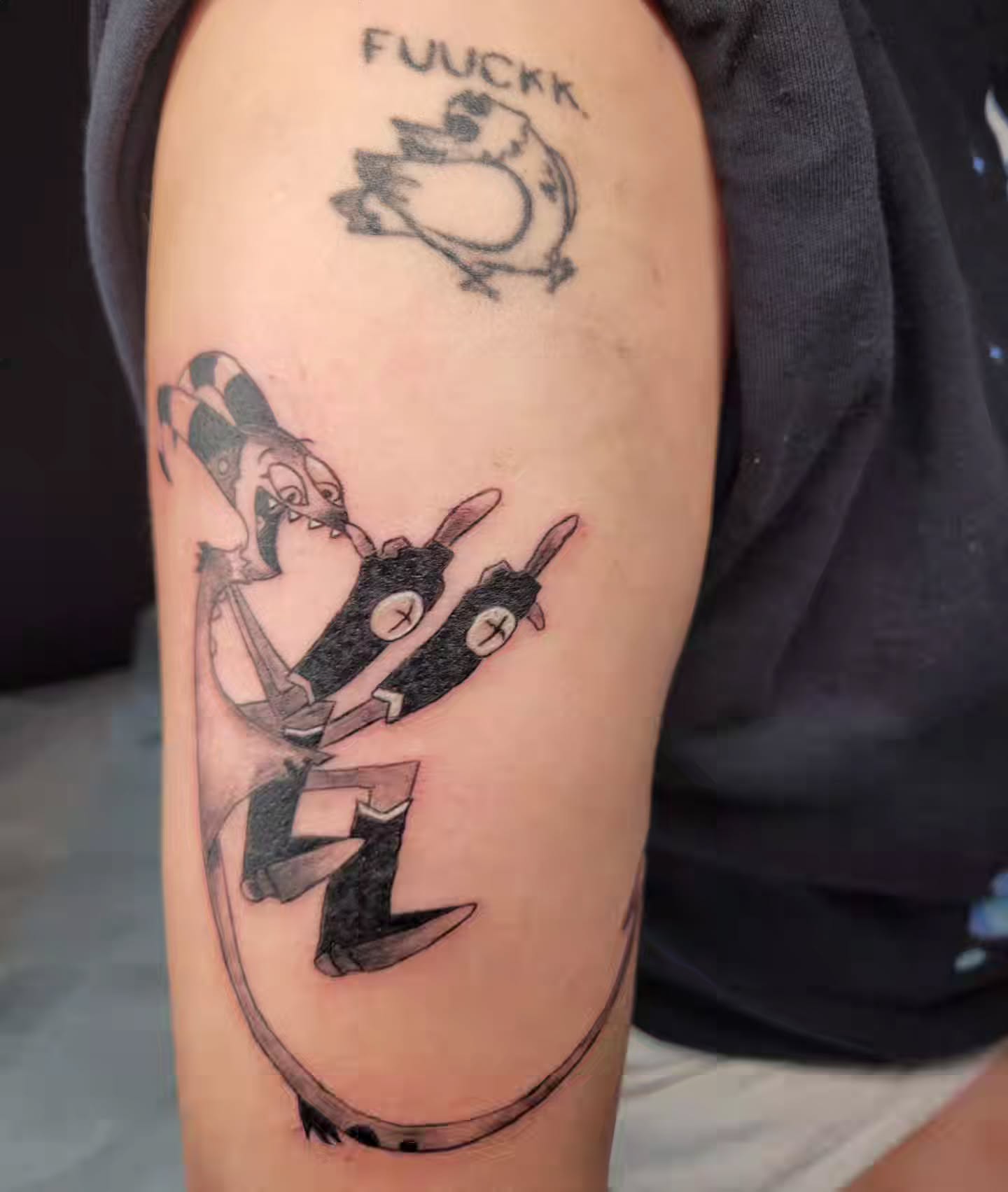 Robotic character black and grey tattoo on the forearm by Bee