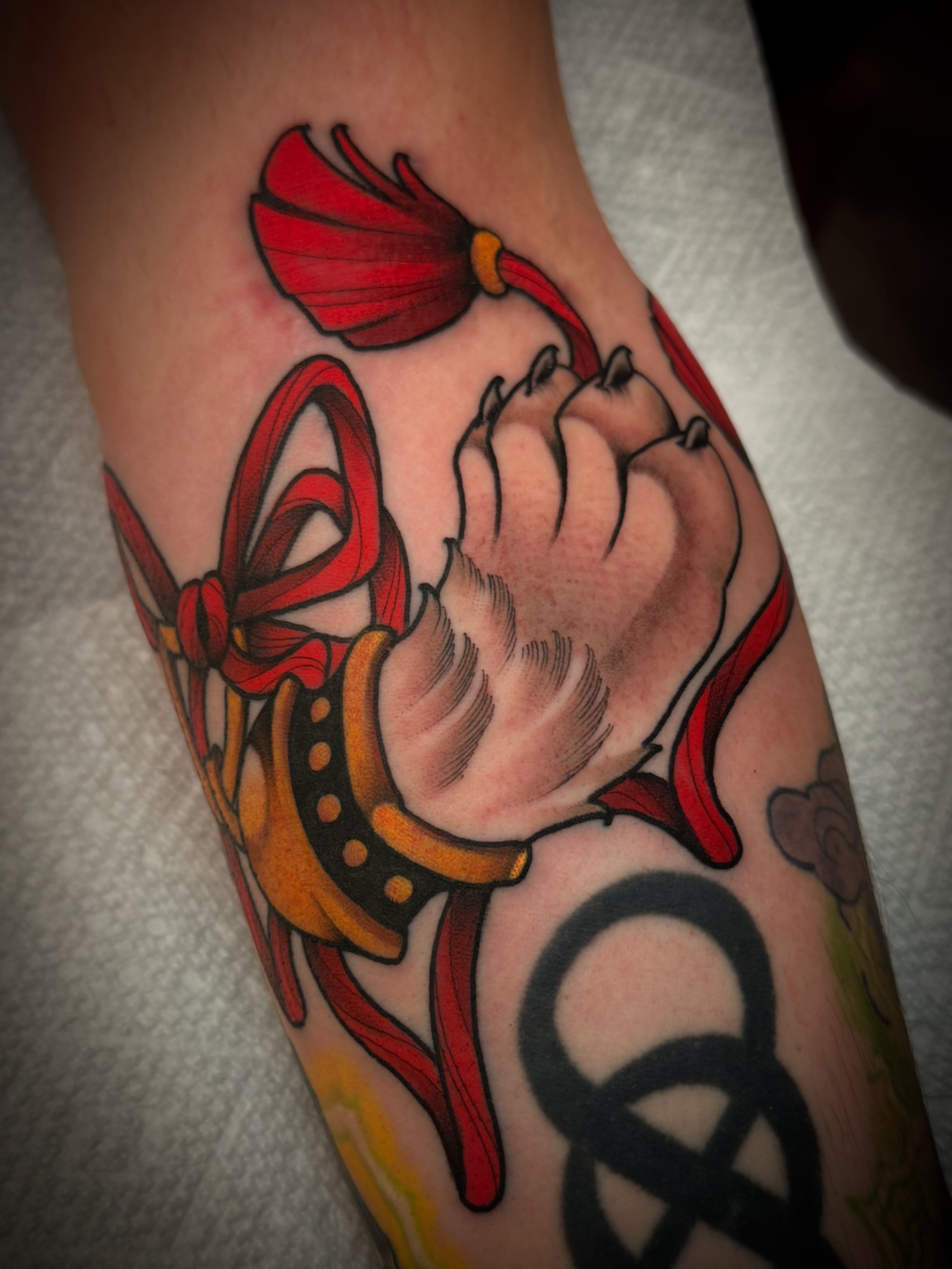 Fist with ribbon American traditional tattoo on the forearm by Dave Osrowitz