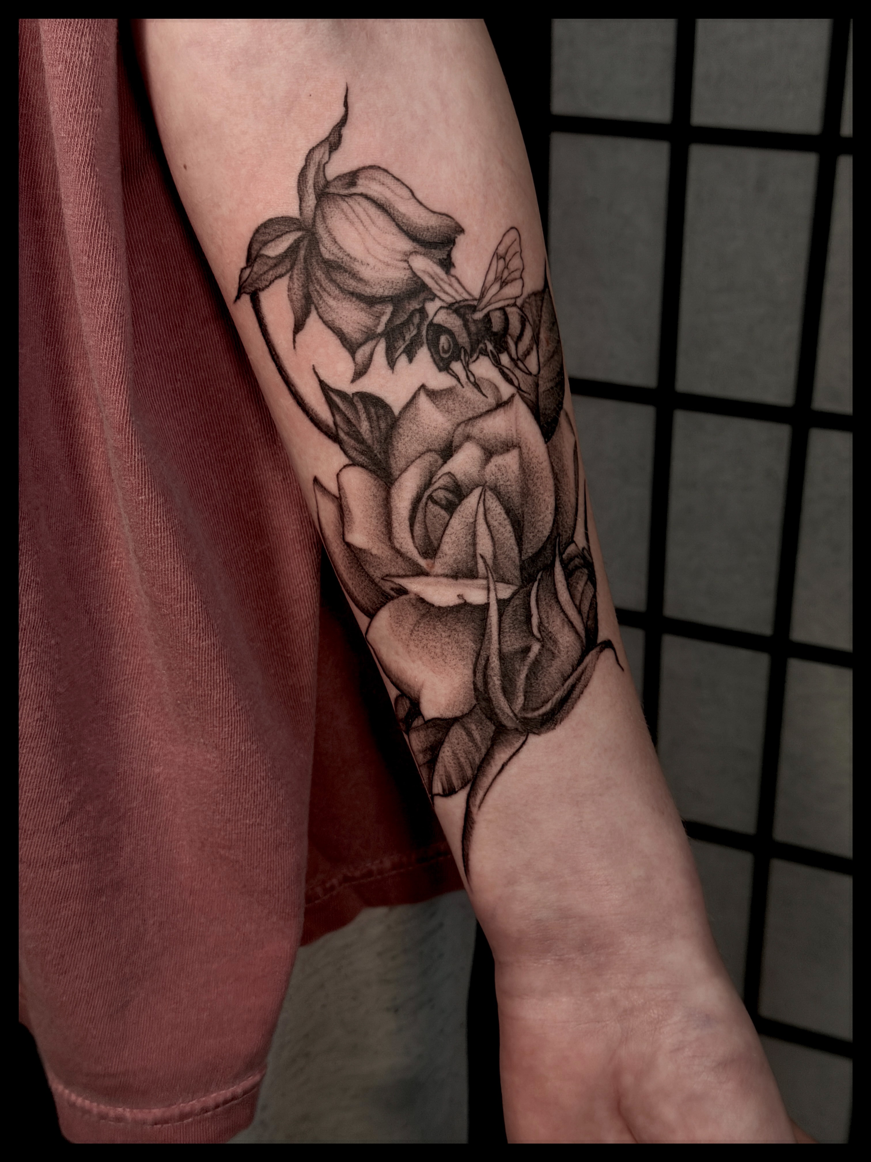 Rose realism tattoo on the forearm by Noah Morris