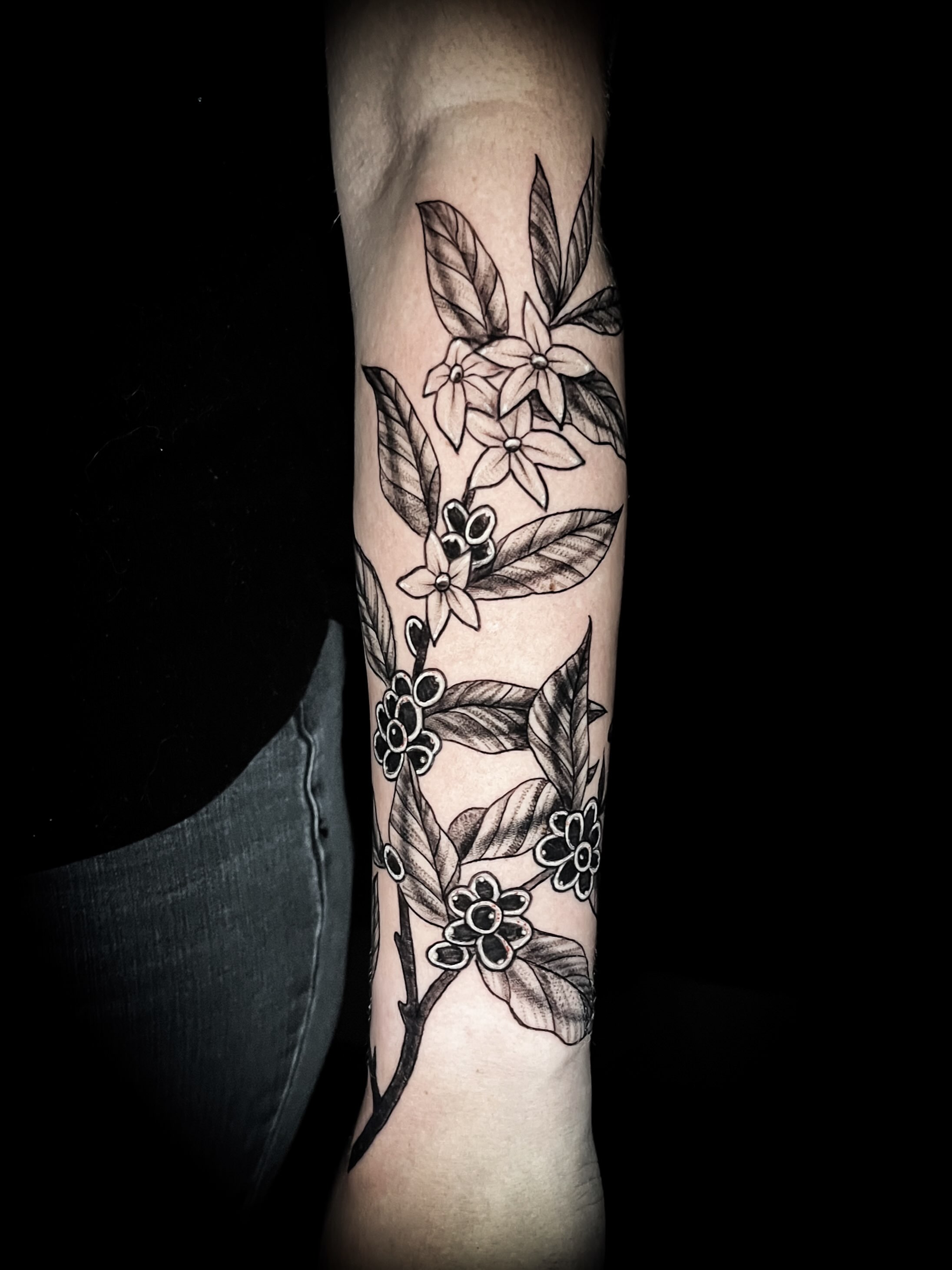 Floral branch black and grey tattoo on the forearm by Lindsay Fernandez, Colorado Springs, Colorado