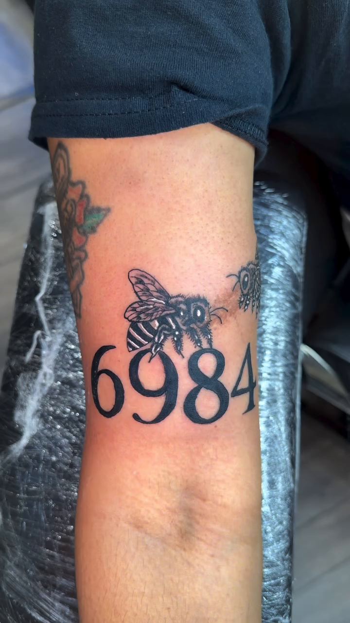 Bee and numbers fine line tattoo by 📍Snellville Tattoo Artist