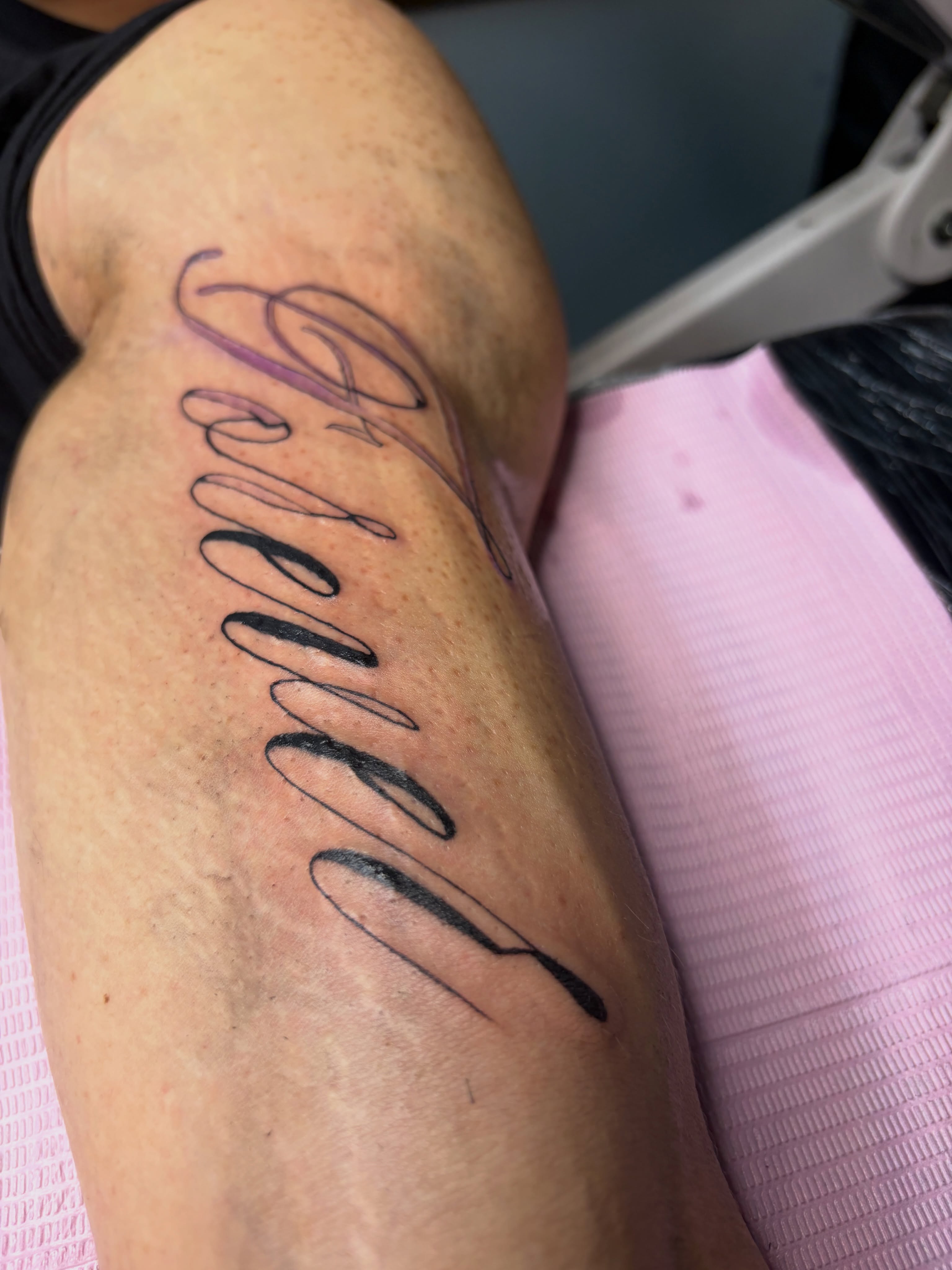 Script lettering lettering script tattoo on the upper arm by Destineé