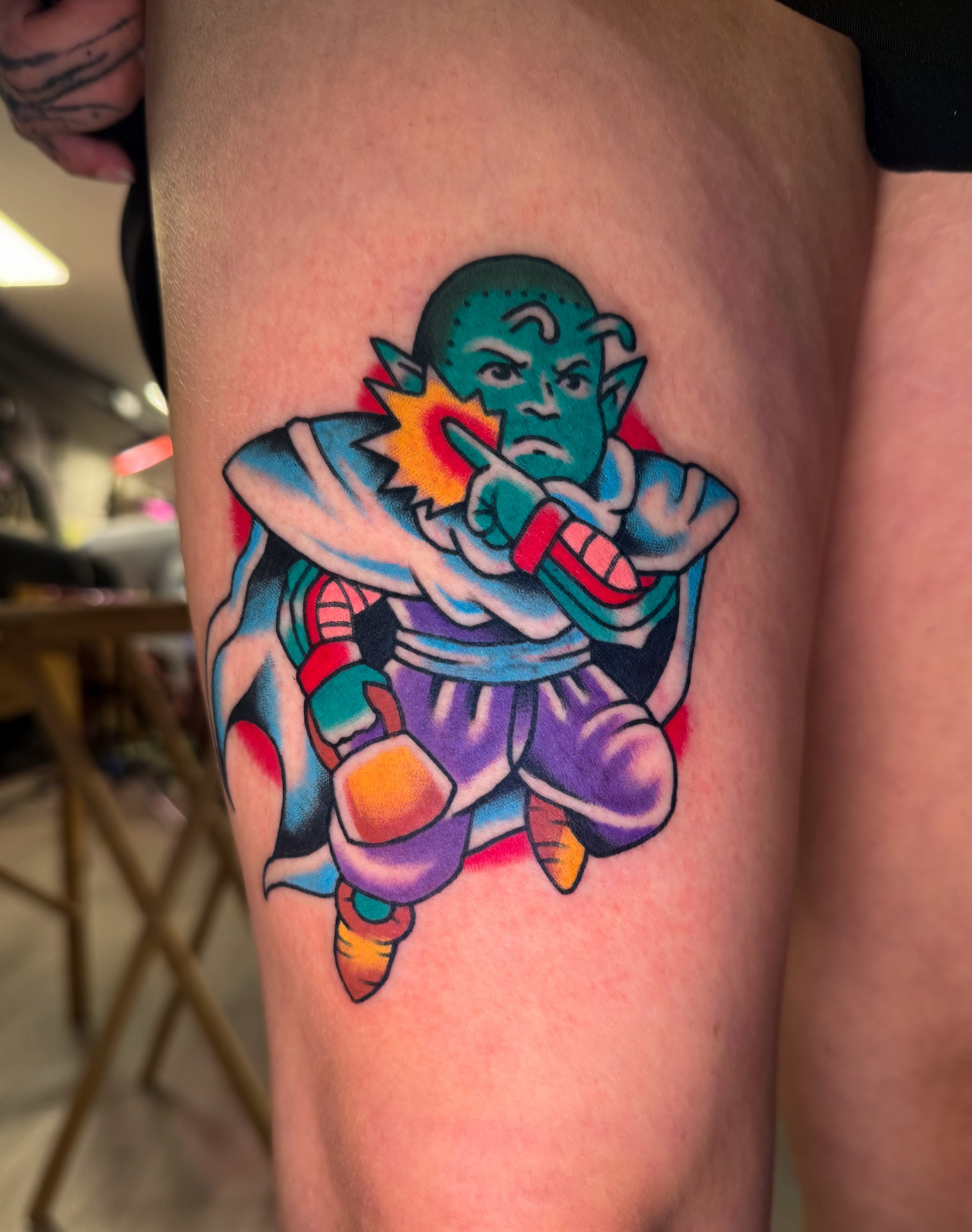 Piccolo anime tattoo on the thigh by Louie Flores