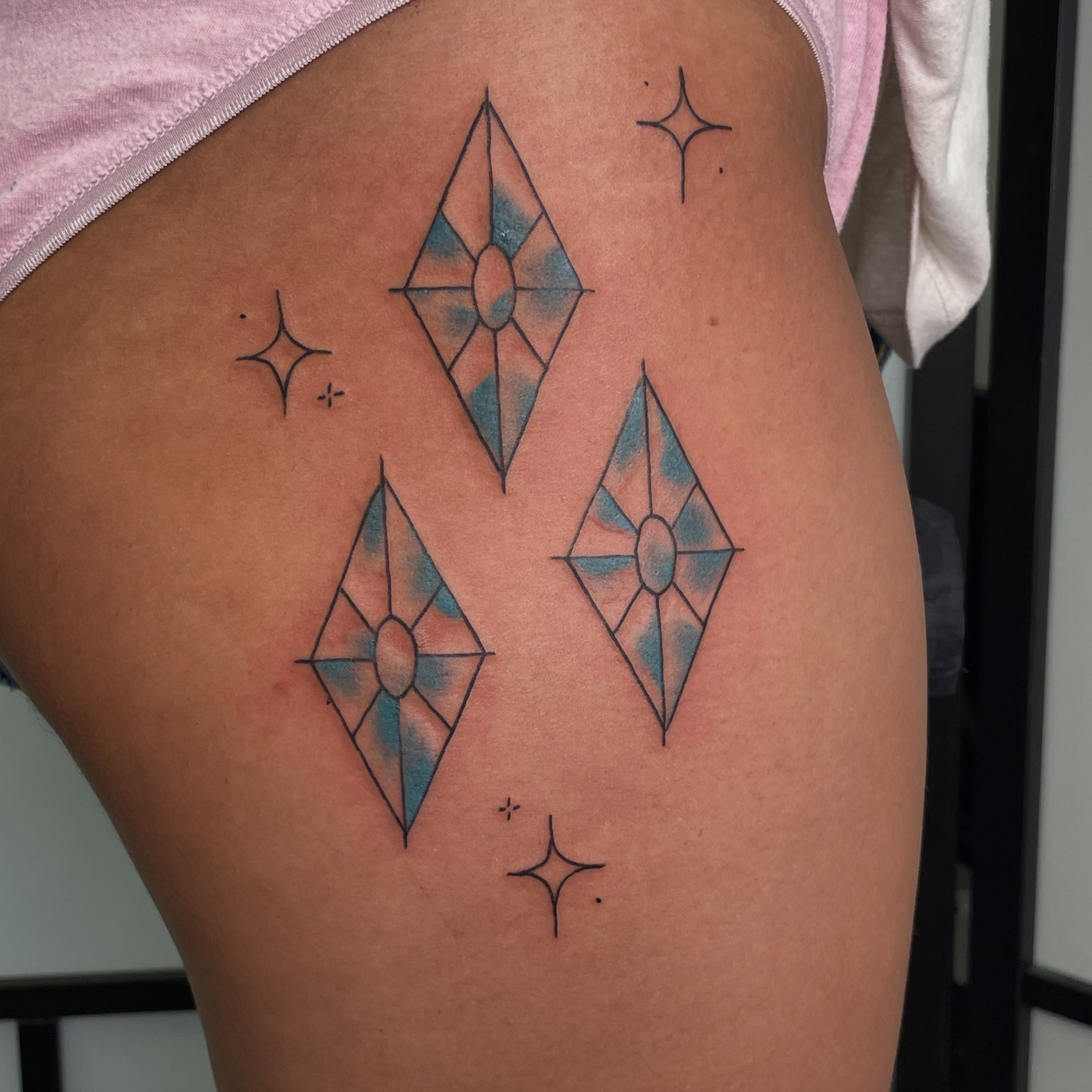Geometric diamond geometric tattoo on the thigh by Gel Clark