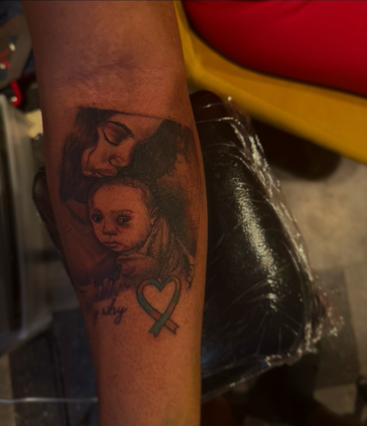 Mother and child realism tattoo on the forearm by Lamb, Philadelphia, Pennsylvania