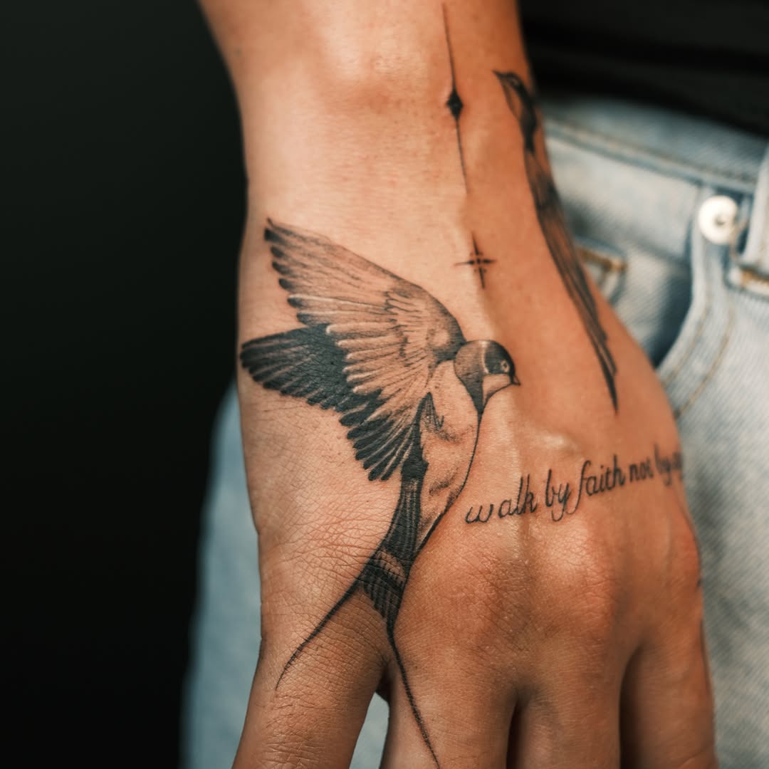 Bird black and grey tattoo on the hand by Vu Nguyen