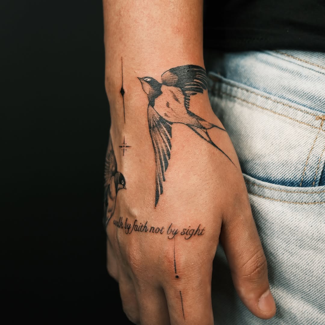 Swallow black and grey tattoo on the hand by Vu Nguyen