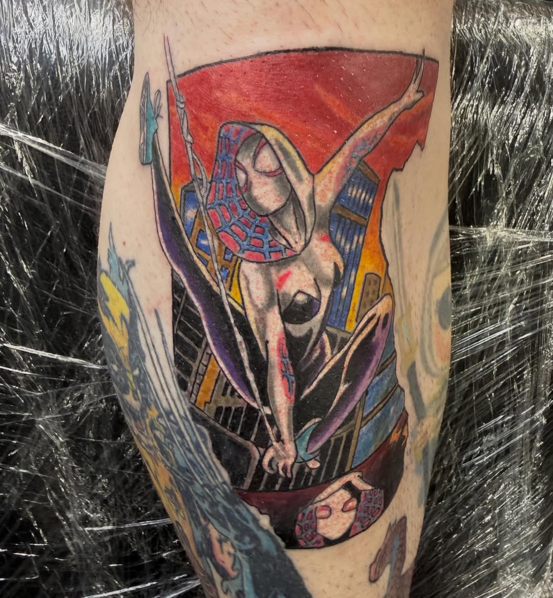 Nude woman with spiderweb mask neo-traditional tattoo on the forearm by Jacob Bettker, Centerville, Ohio