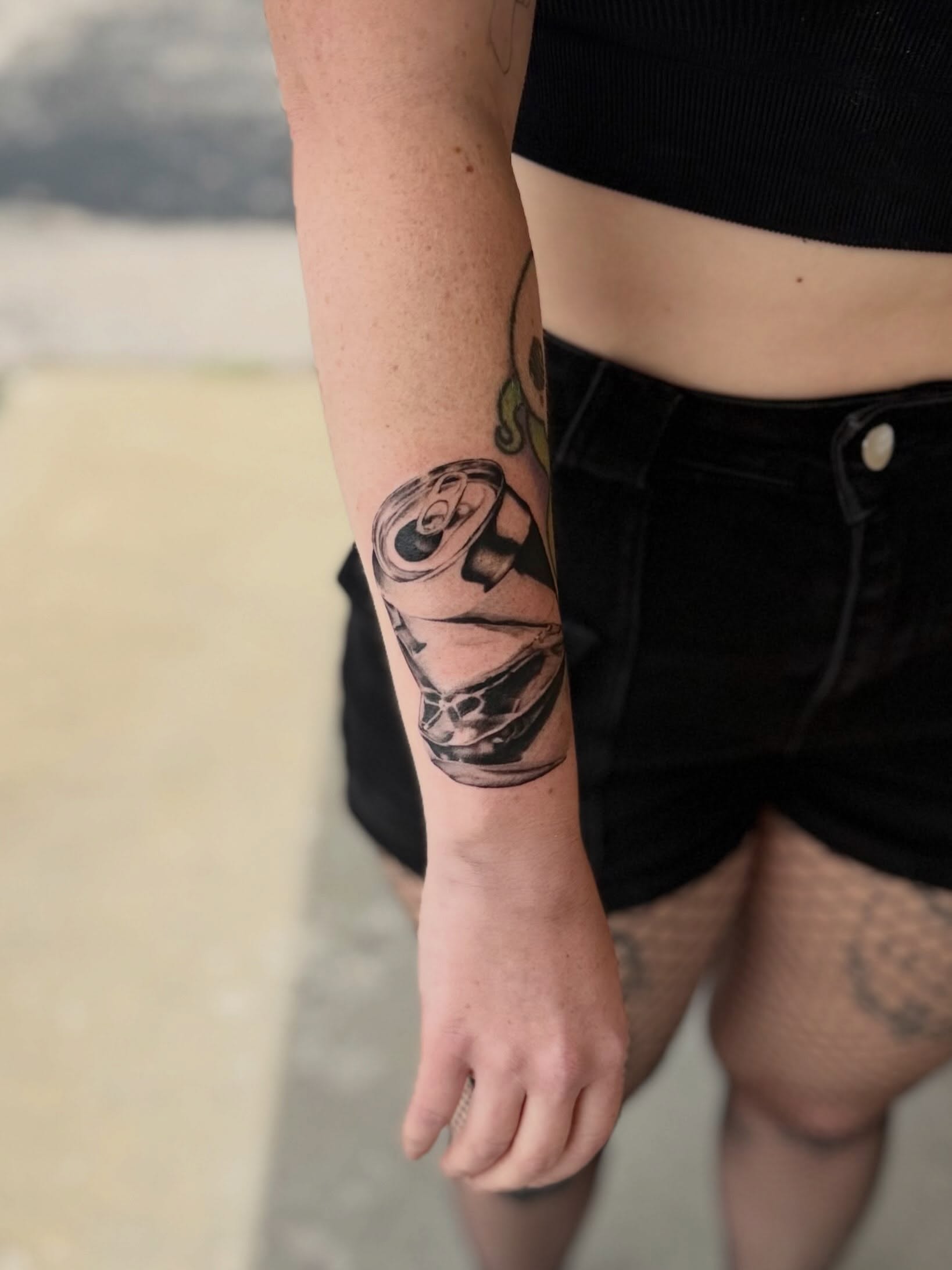 Can black and grey tattoo on the forearm by Rebecca (Becca) Ray