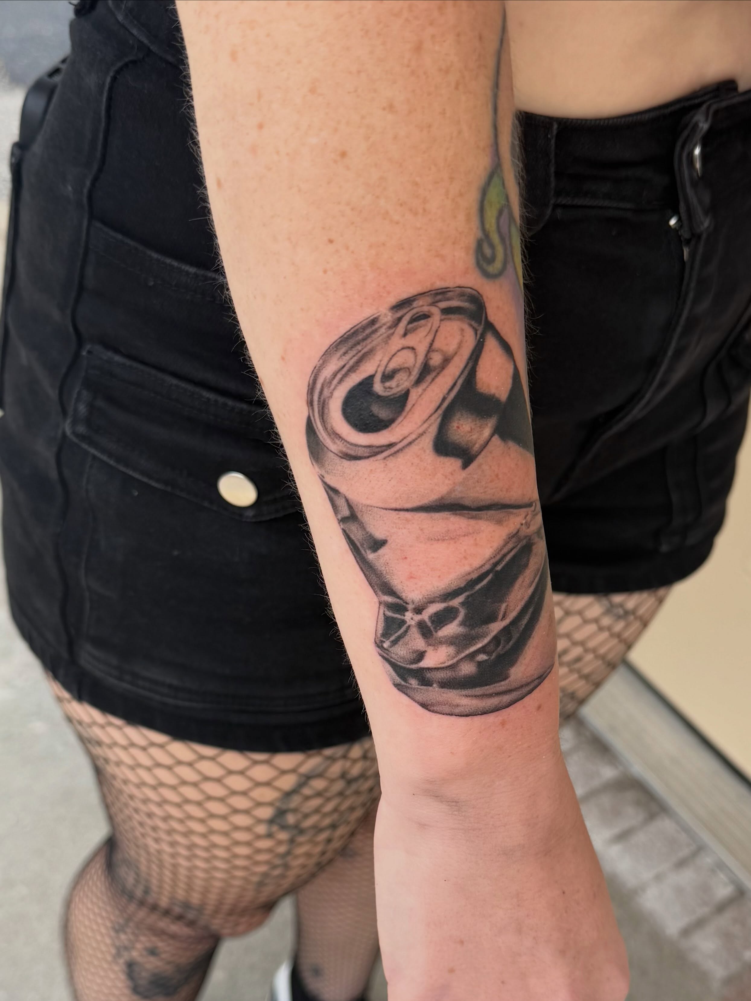 Can black and grey tattoo on the forearm by Rebecca (Becca) Ray