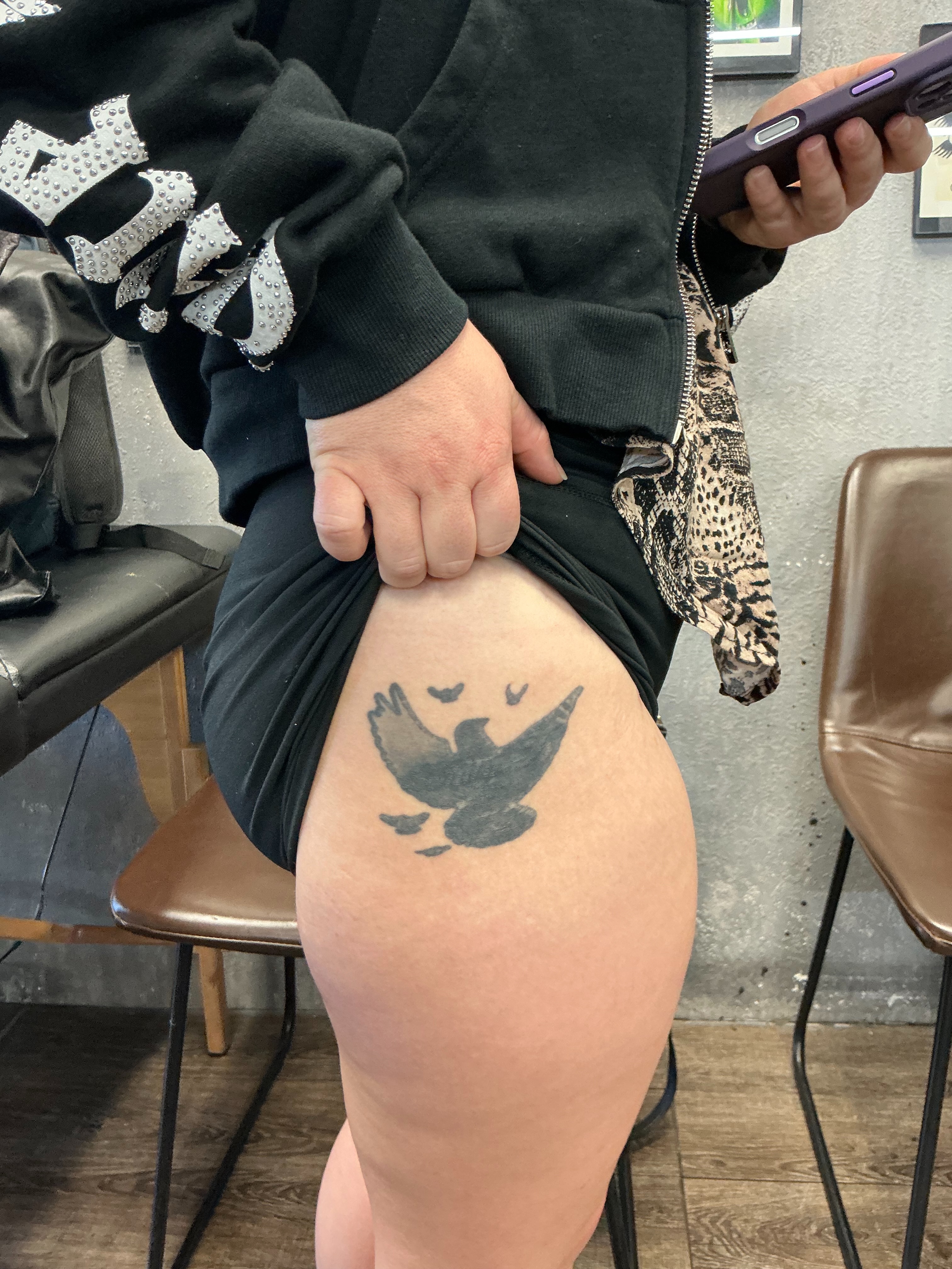 Bird black and grey tattoo on the thigh by Chris
