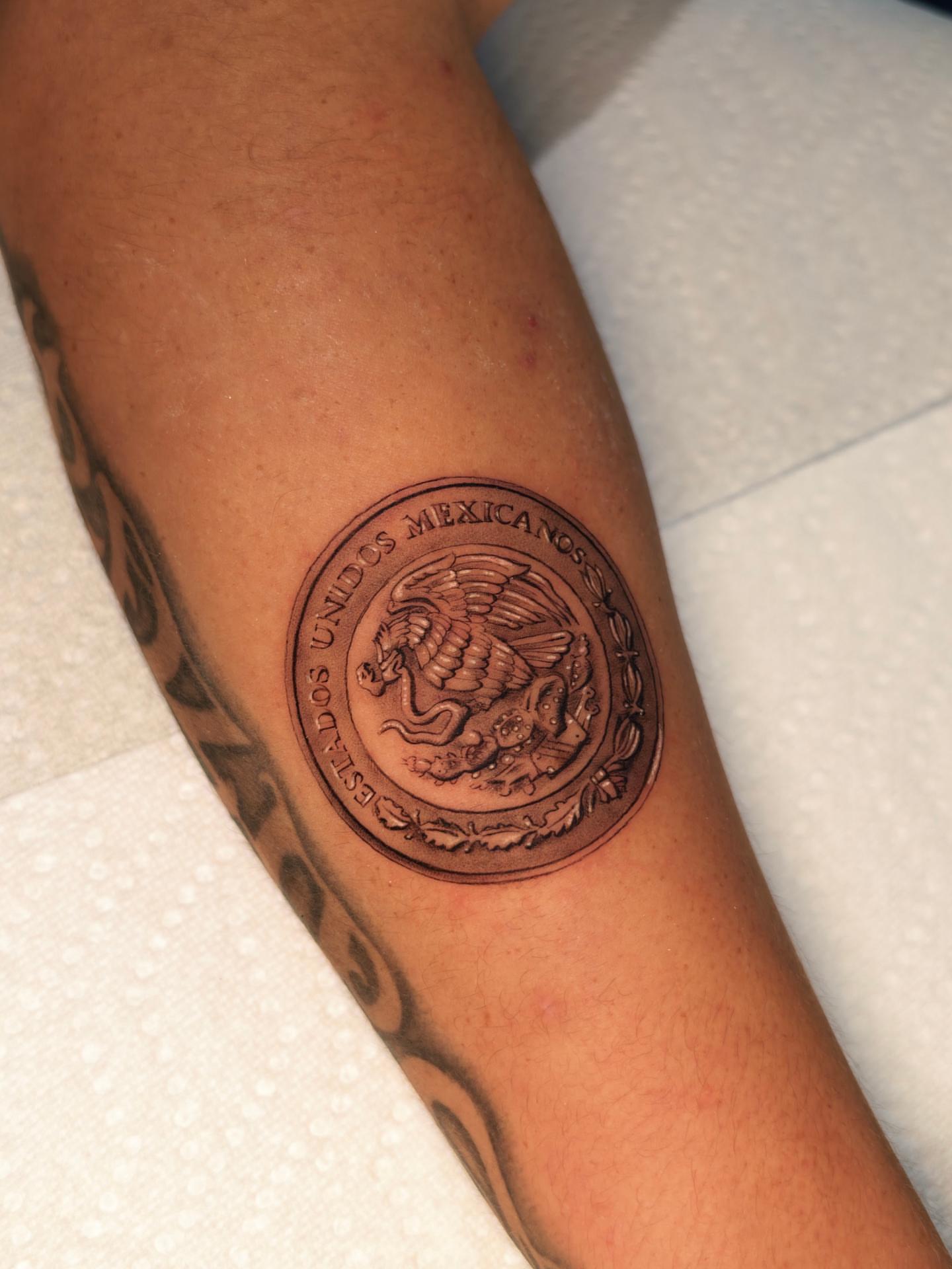 Mexican seal black and grey tattoo on the forearm by Jess Dominguez