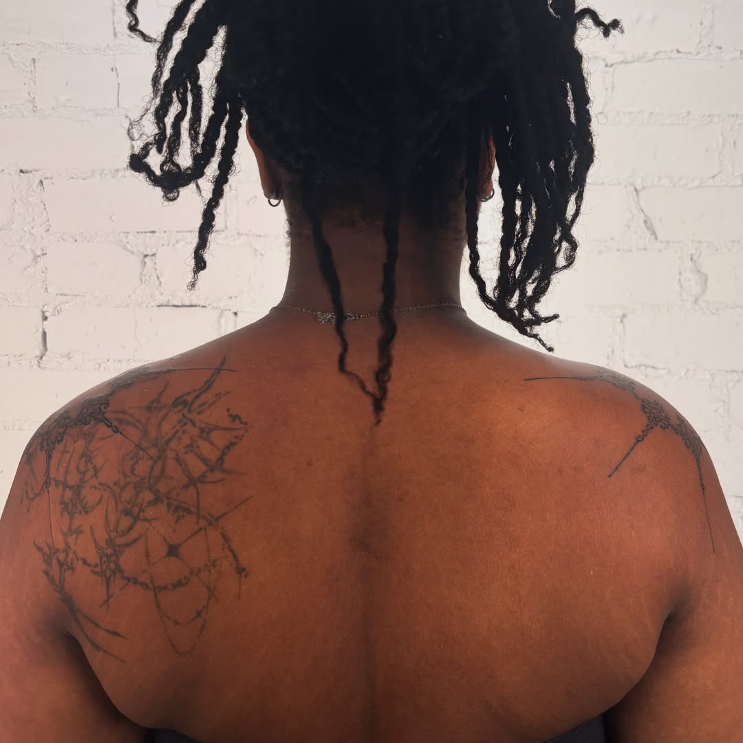 Spine tattoo black and grey tattoo on the back by laura bianca