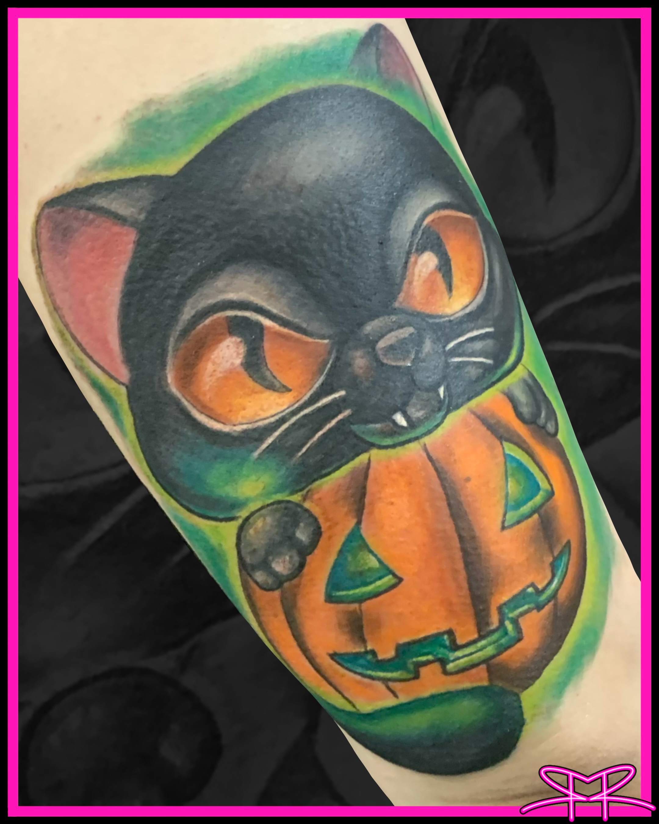 Black cat with pumpkin American traditional tattoo on the forearm by Robert Ripoll