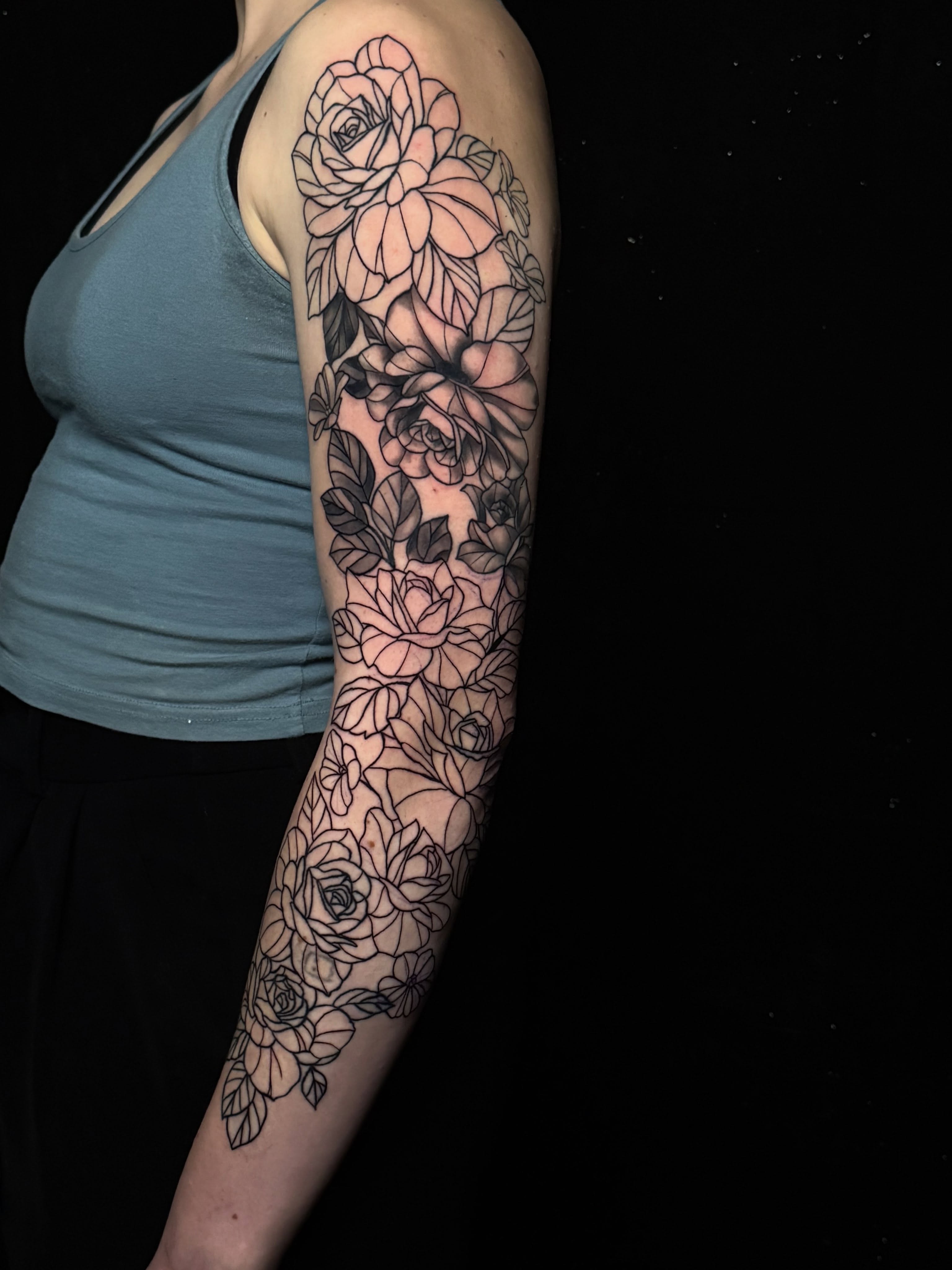 Roses black and grey tattoo on the forearm by Brandiane Wells
