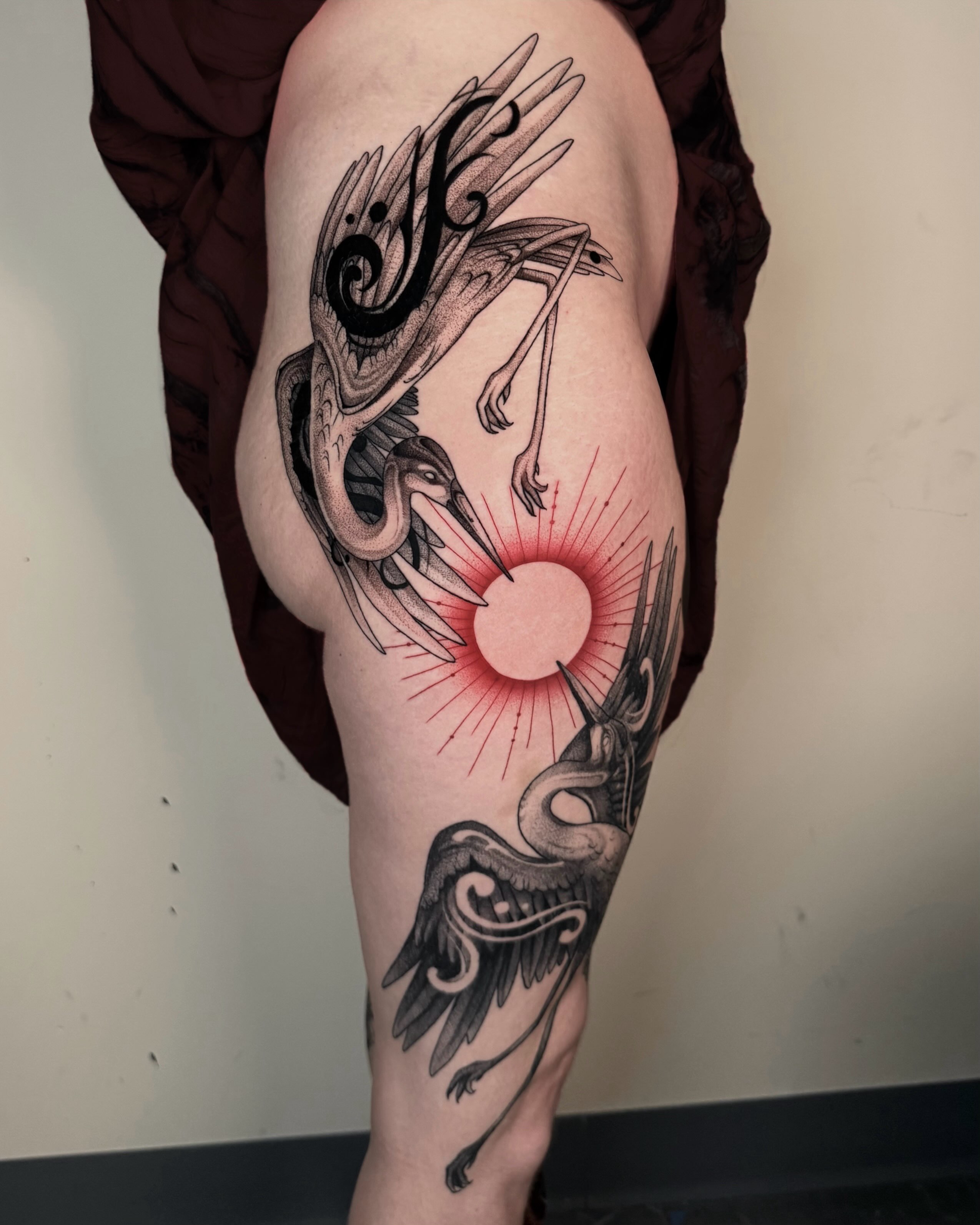 Phoenix and sun dotwork tattoo on the thigh by jada