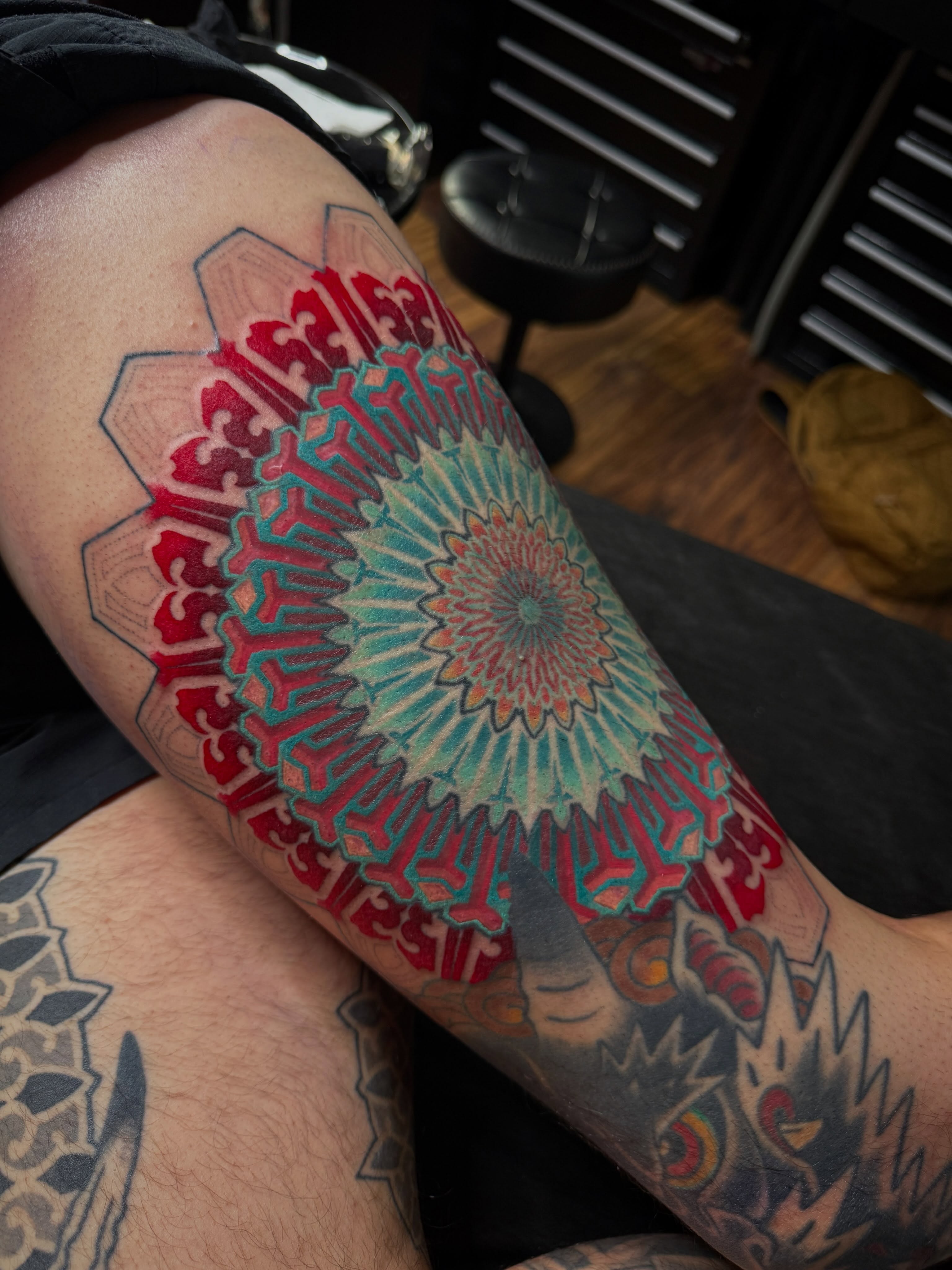 Mandala geometric tattoo on the forearm by Jymi Calkins