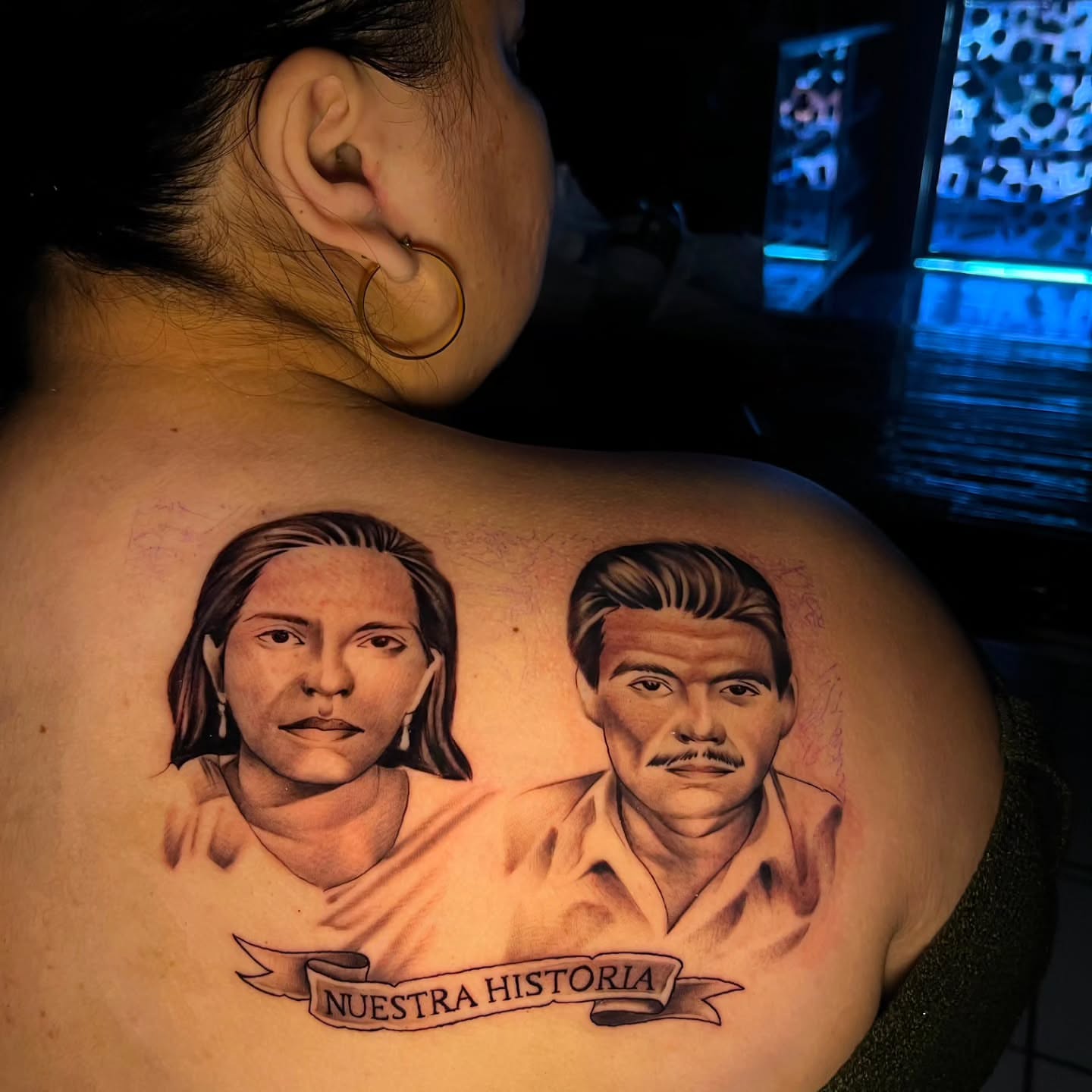 Portrait of two individuals realism tattoo on the back by El Salvador Tattoo Artist