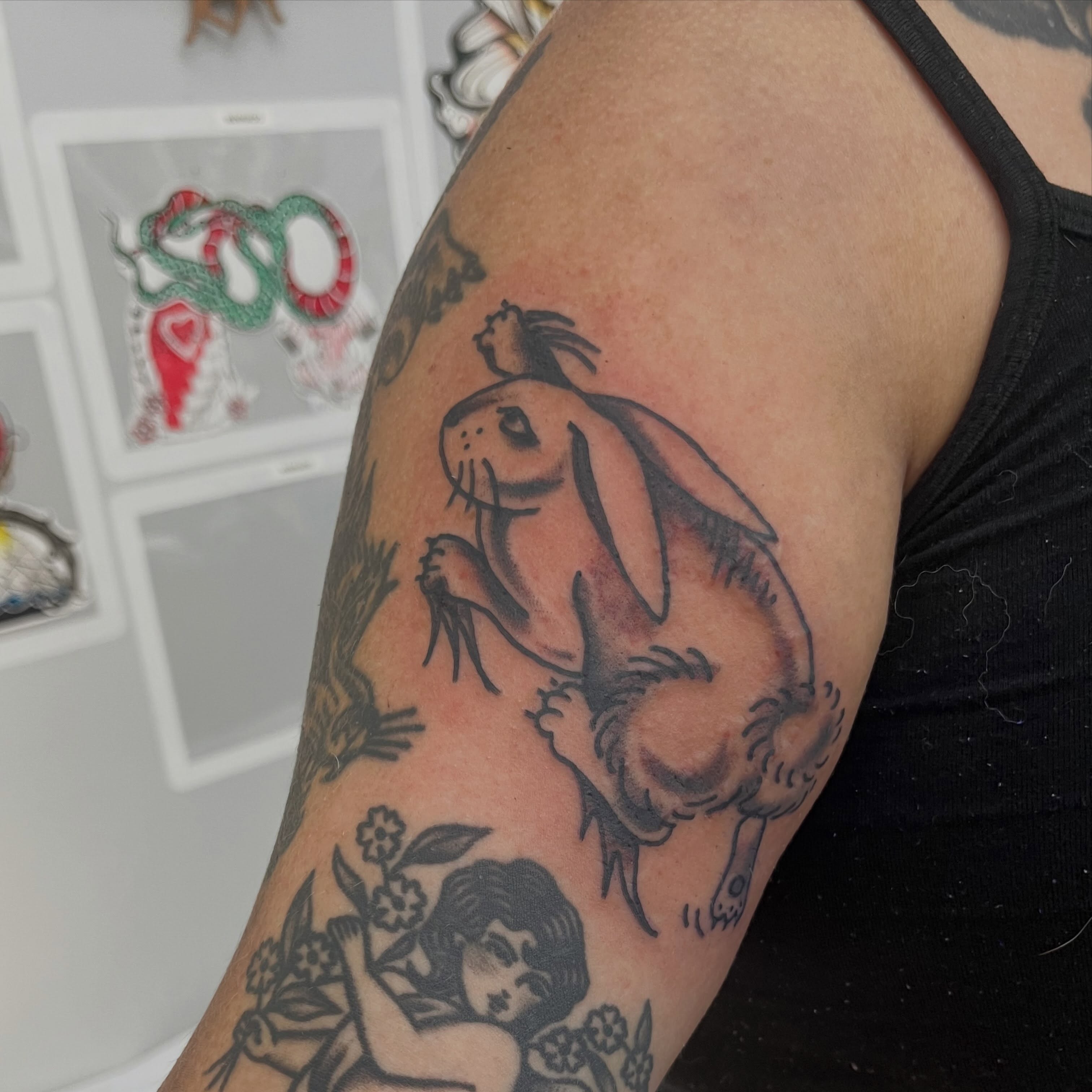 Rabbit black and grey tattoo on the upper arm by Sour Tattoo, Somerville, Massachusetts