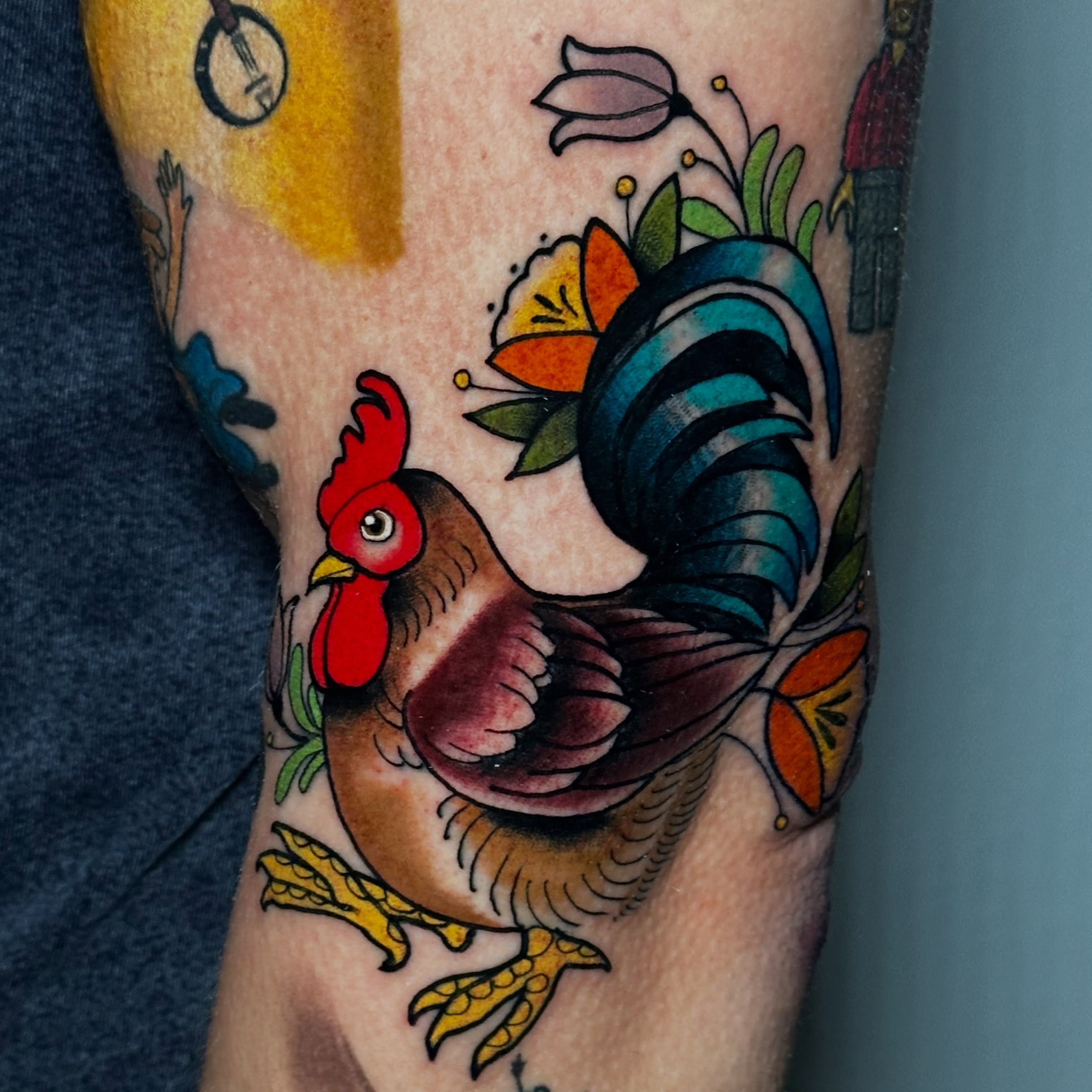 Rooster American traditional tattoo on the forearm by Liz McDonald