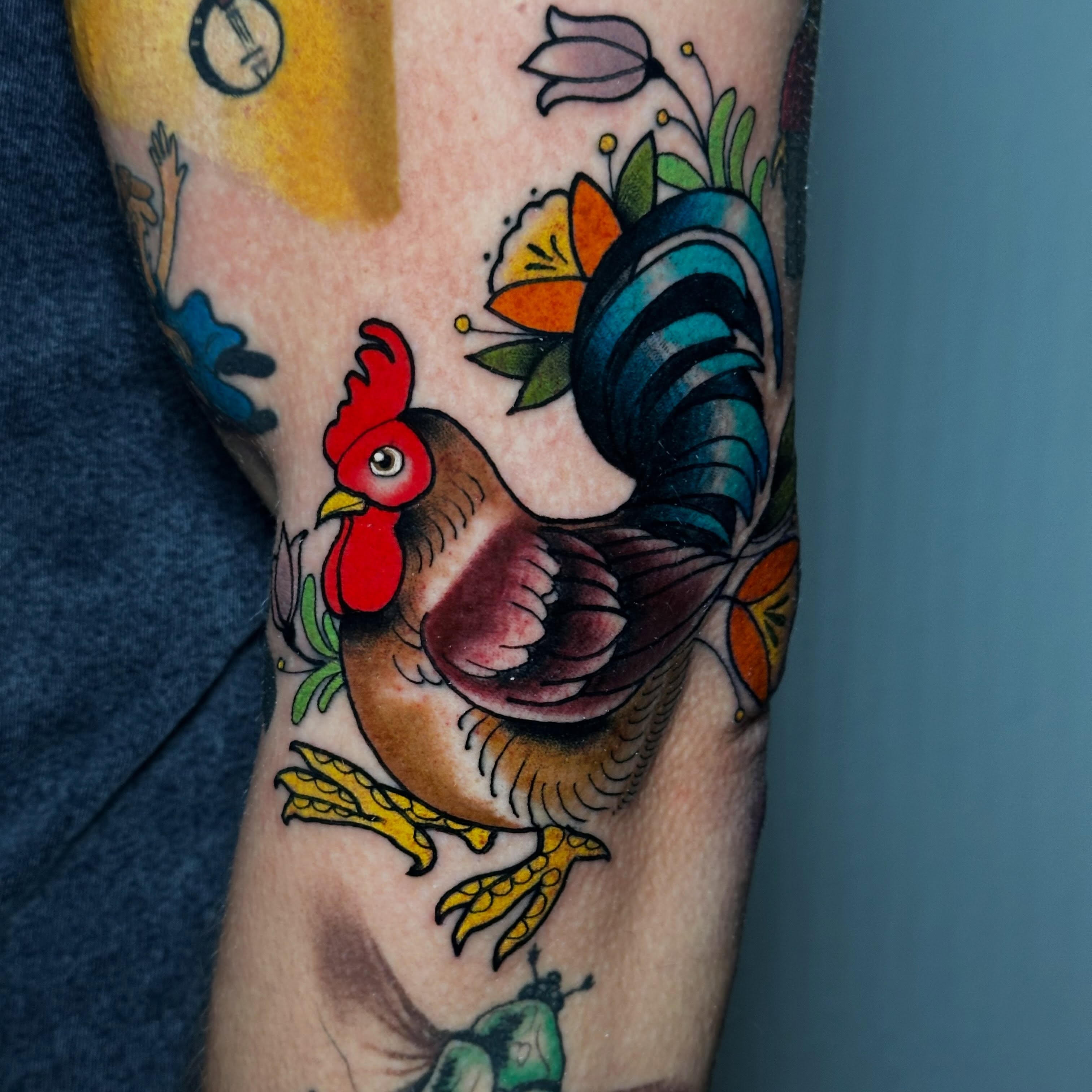 Rooster American traditional tattoo on the forearm by Liz McDonald