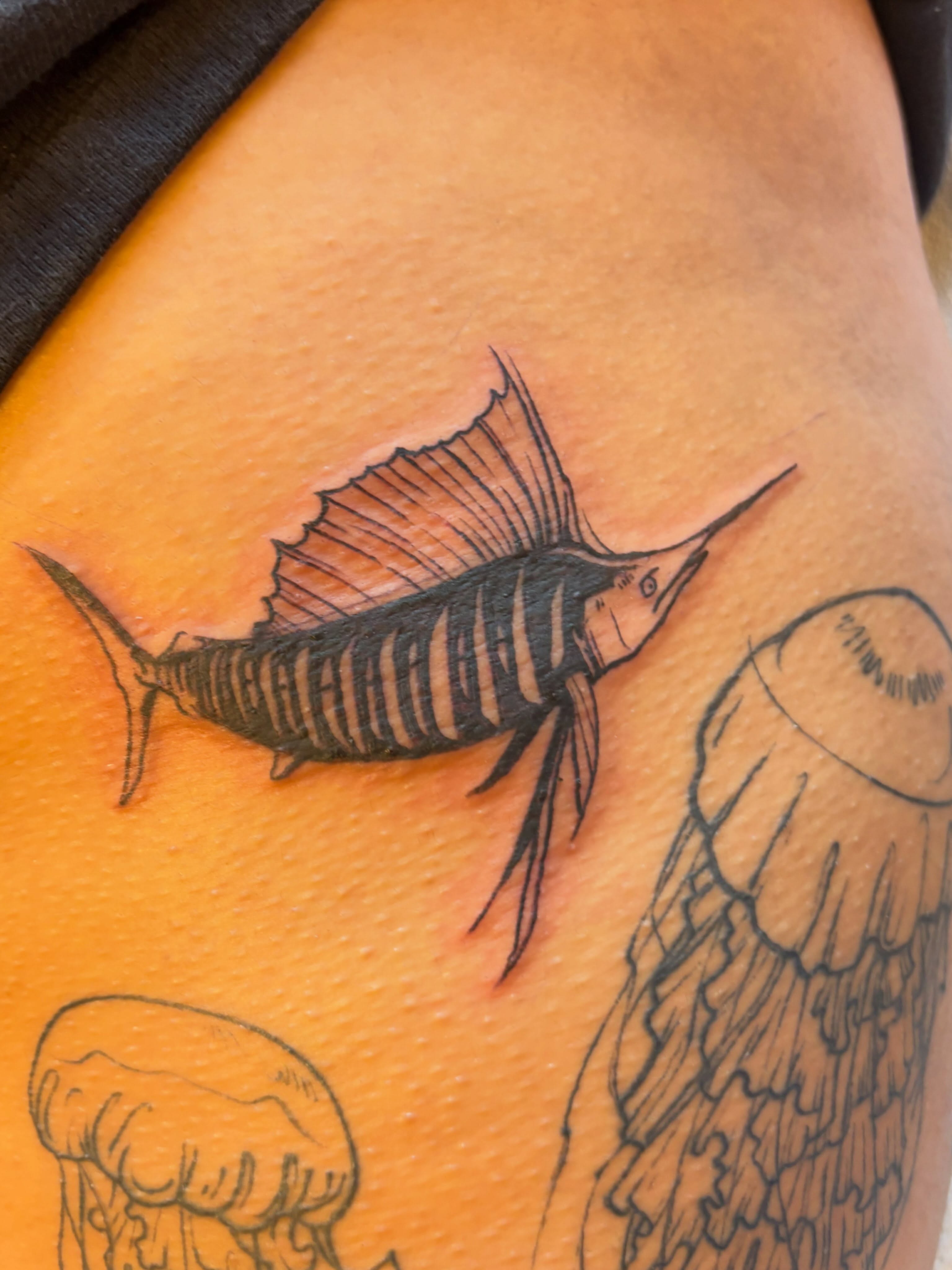 Sailfish realism tattoo on the thigh by Zoe Brookes