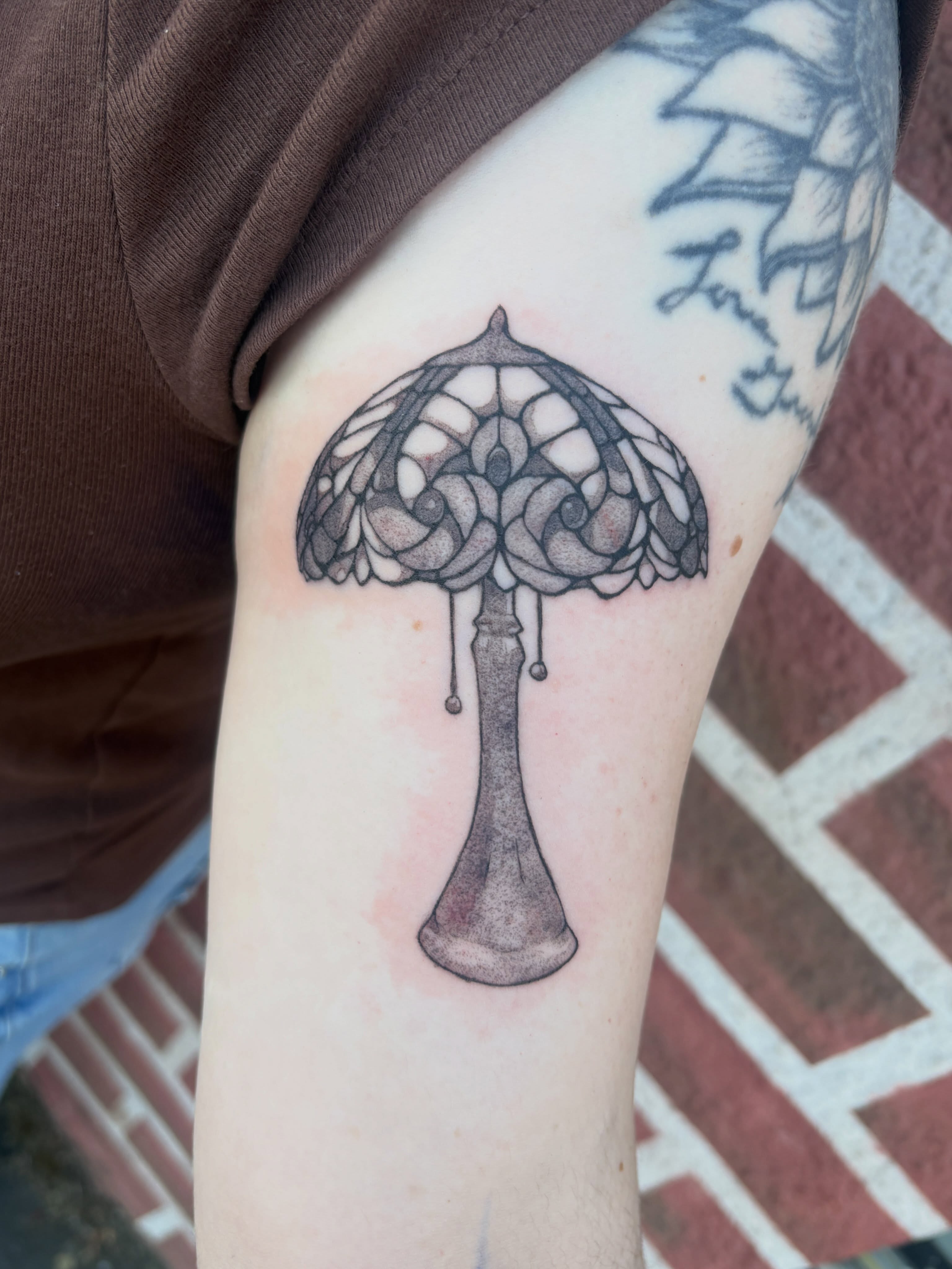 Lampshade black and grey tattoo on the forearm by izzy solae
