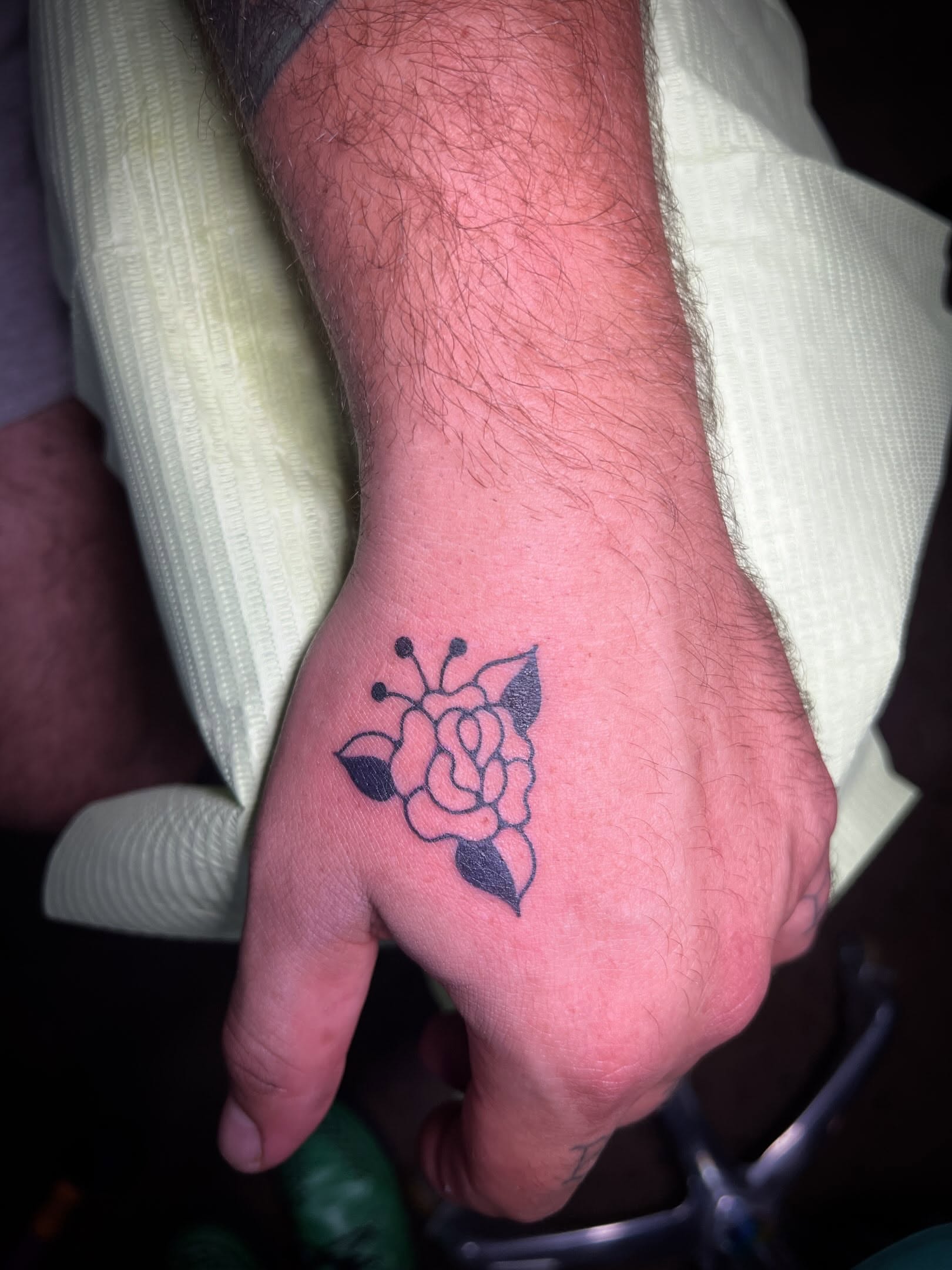 Rose dotwork tattoo on the hand by Tattoo Kayla