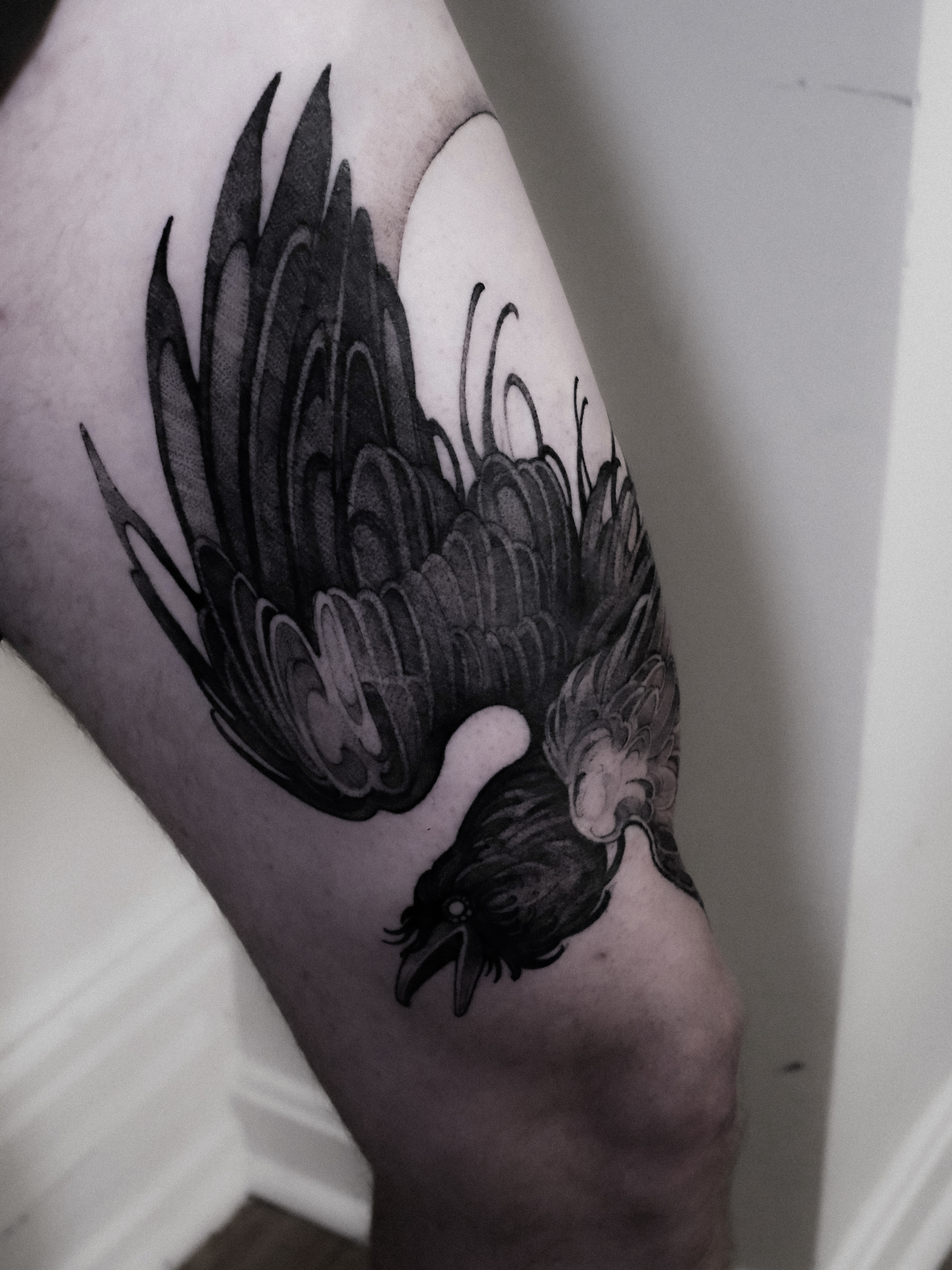 Bird black and grey tattoo on the forearm by Alena Zozulenko