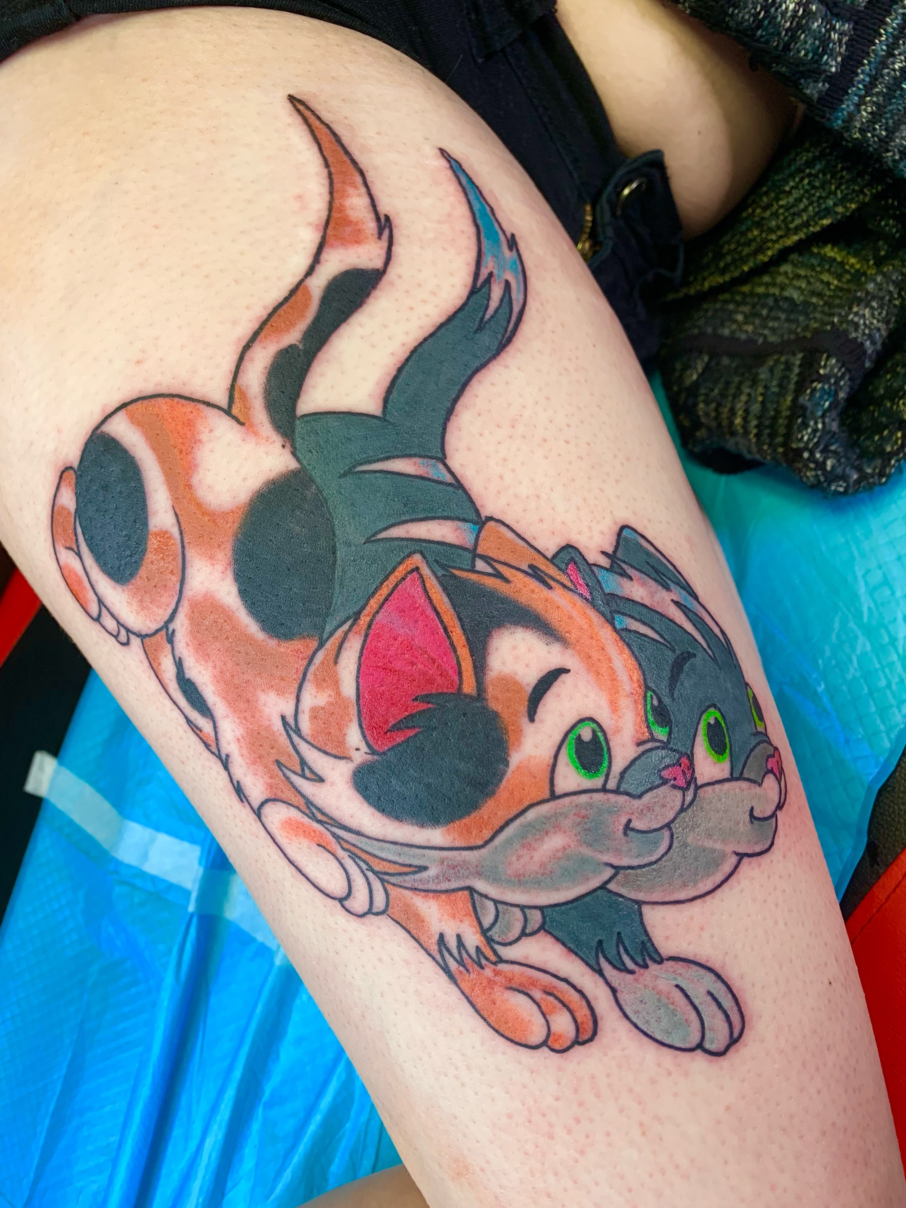 Cat anime tattoo on the thigh by El Kapitan