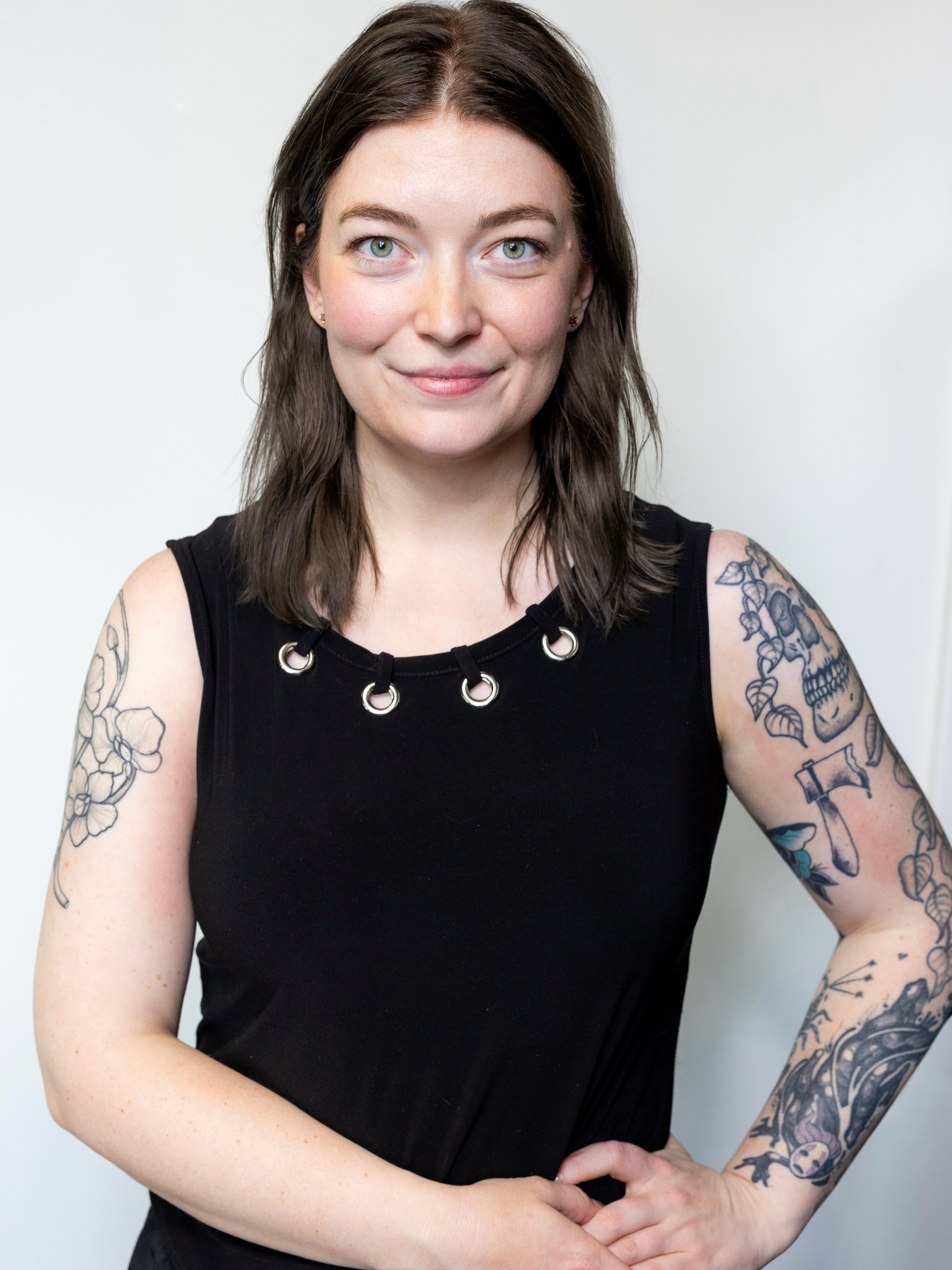 Floral black and grey tattoo on the upper arm by Rachel Hanke