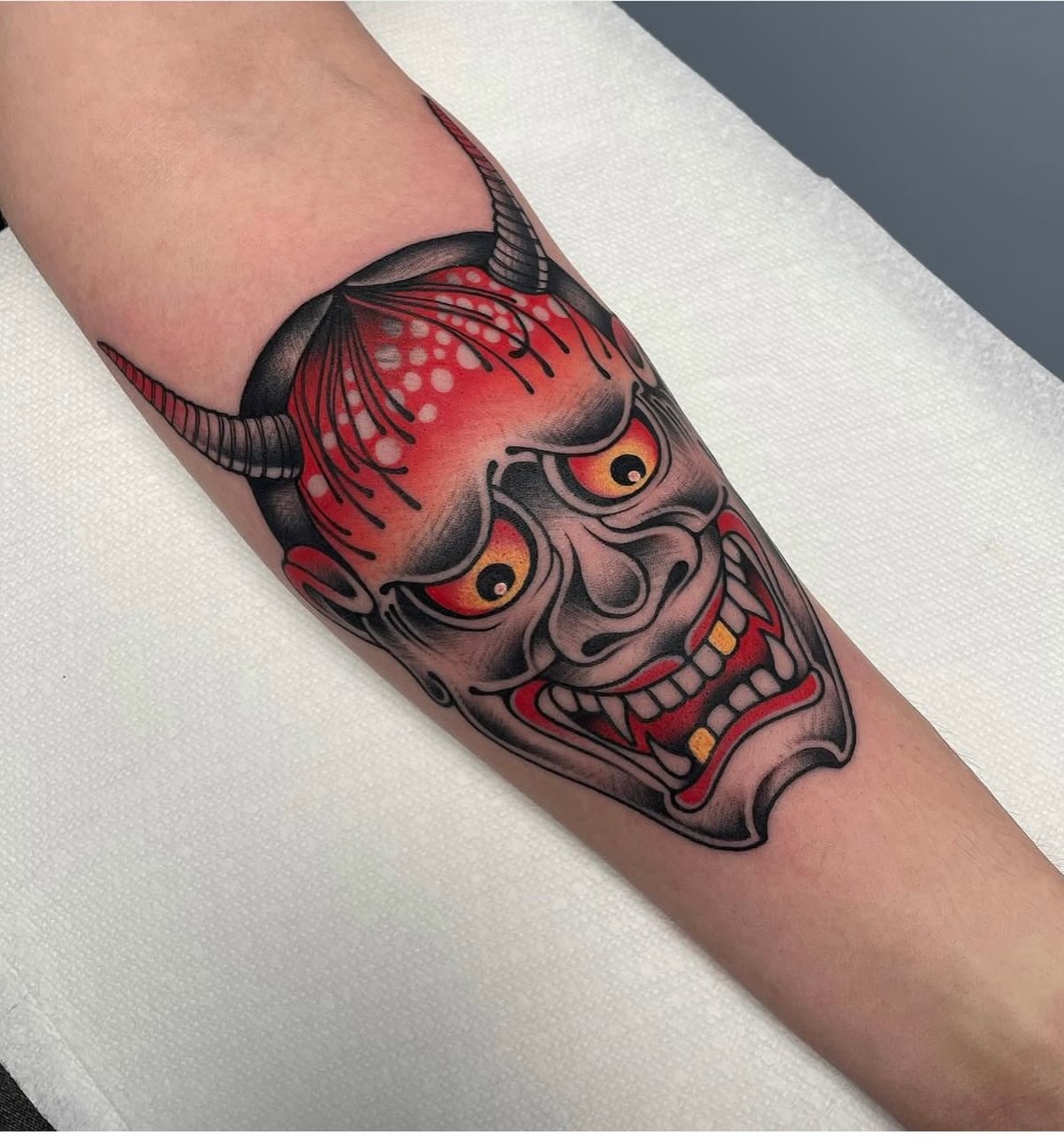 Demon mask japanese irezumi tattoo on the forearm by Mark Boller