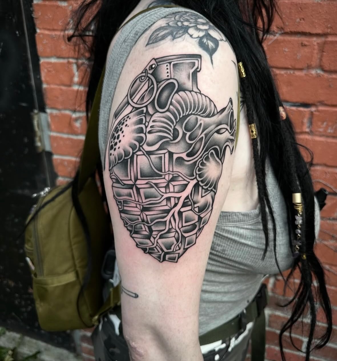 Mechanical heart geometric tattoo on the shoulder by Mark Boller